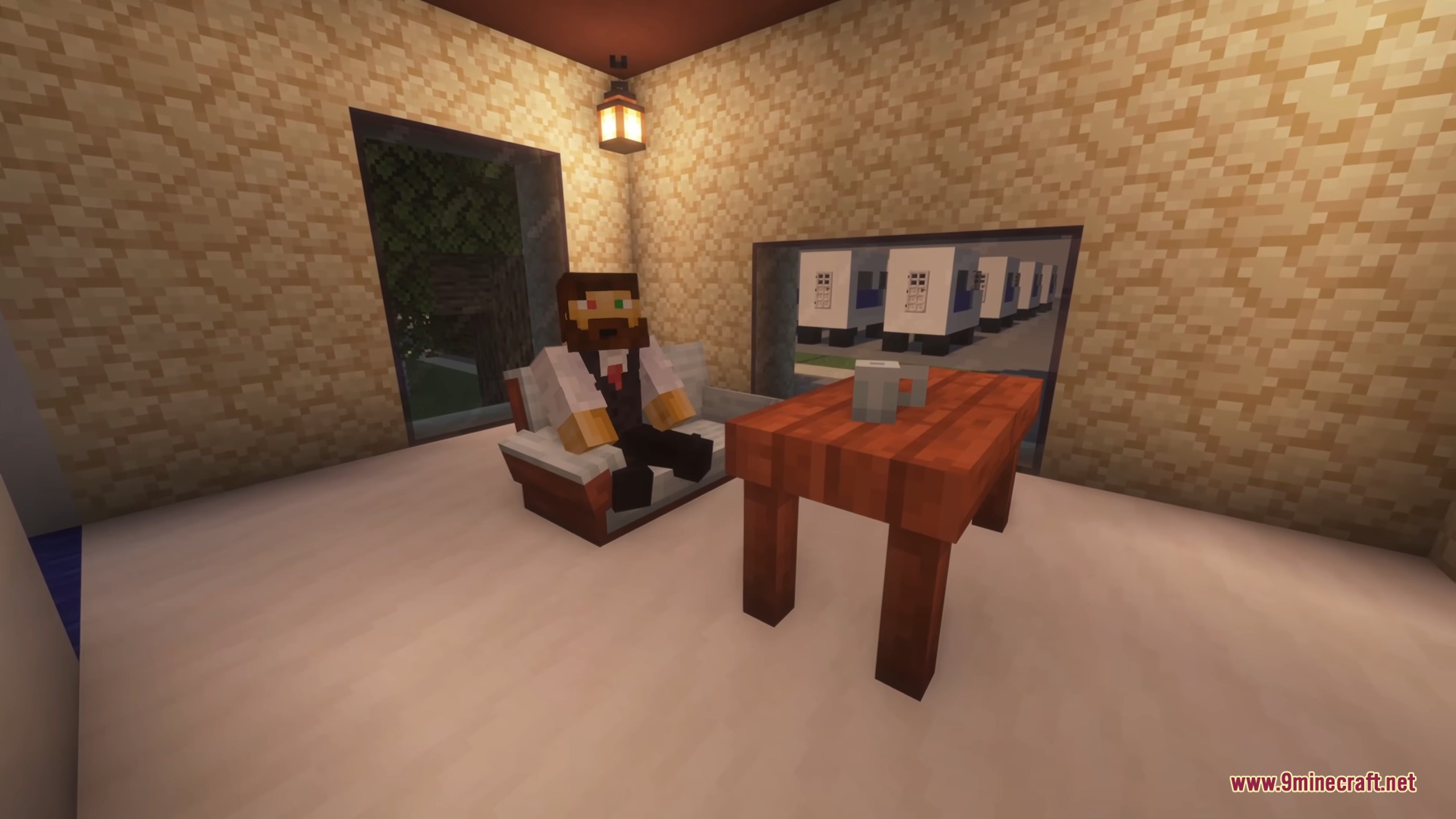 A bearded character sitting on a sofa next to a table with a mug