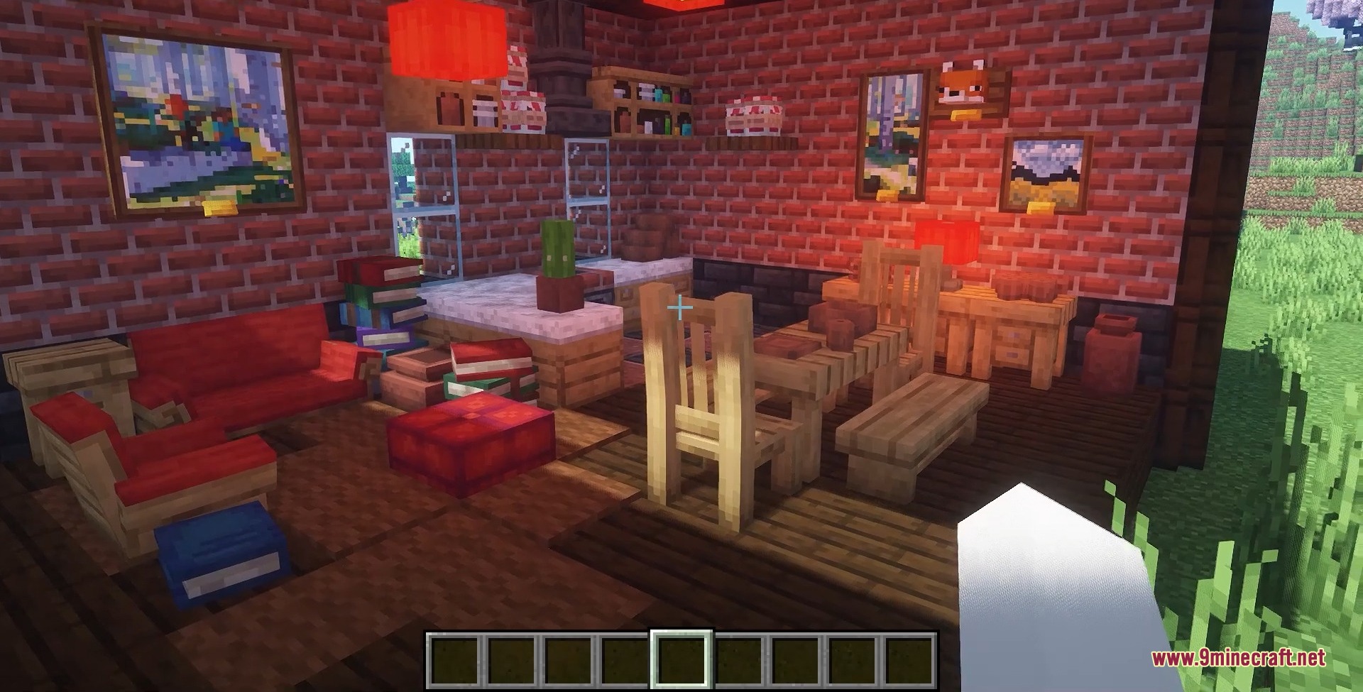 A cozy interior featuring brick walls red sofas and wooden dining furniture