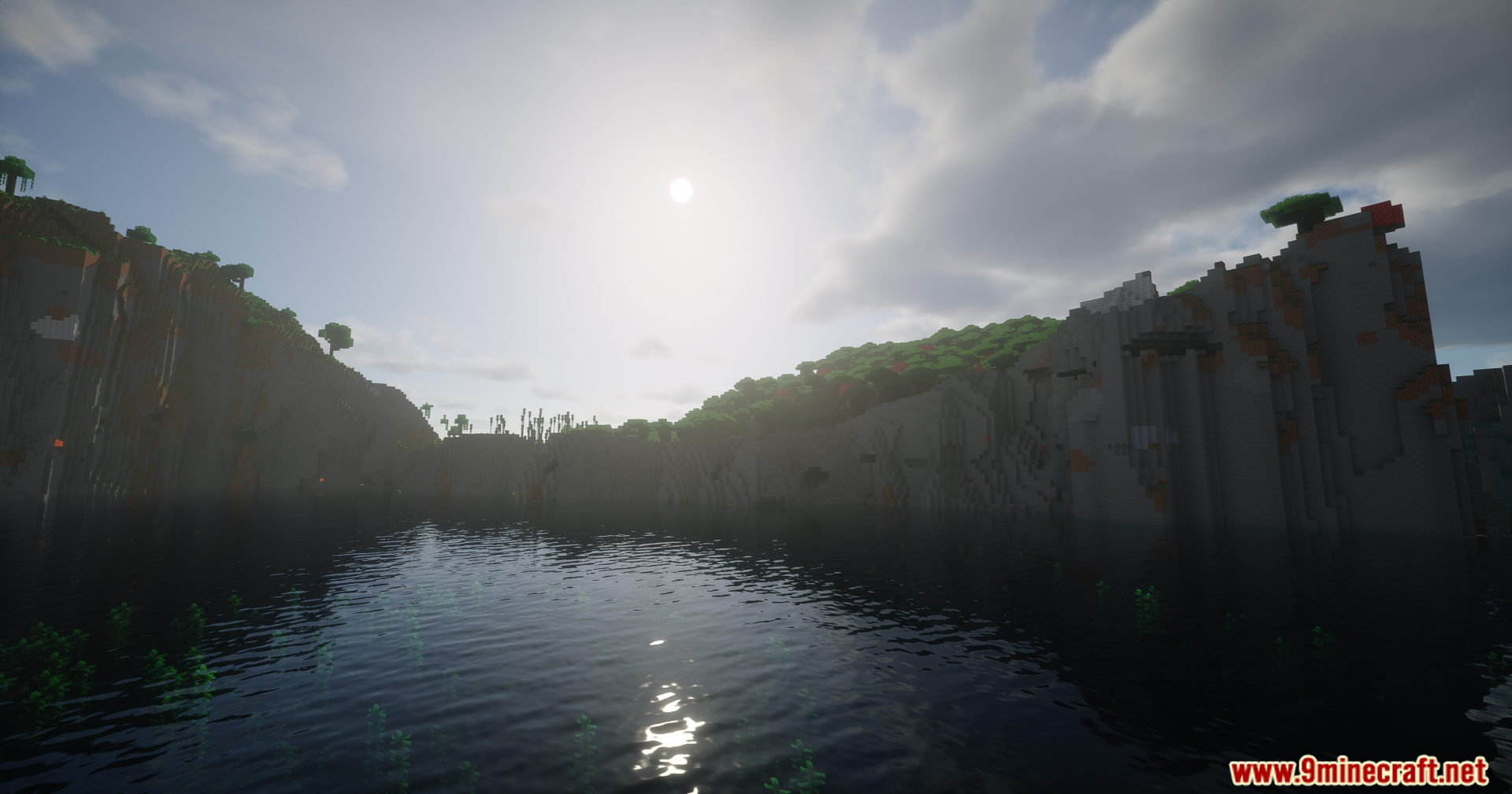 Helian MMCO Sundial Lite Edit Shaders Screenshot 1 A bright sun shining over a calm lake surrounded by tall rocky cliffs