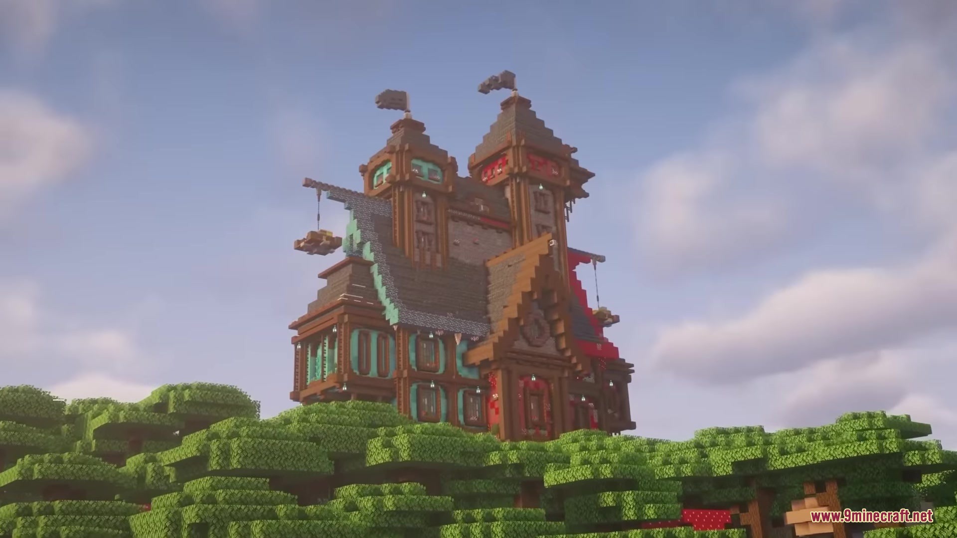 The Twin Keep structure with two towers and flags on a hill