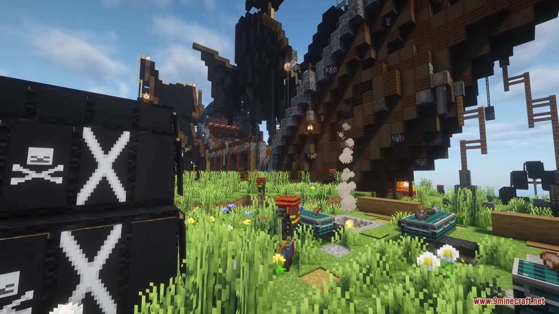 Pirate camp with black skull banners and a campfire in a grassy field