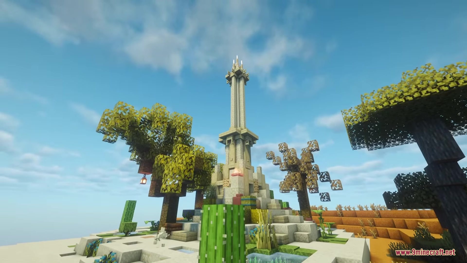 A tall stone obelisk stands in a desert landscape with cacti and trees