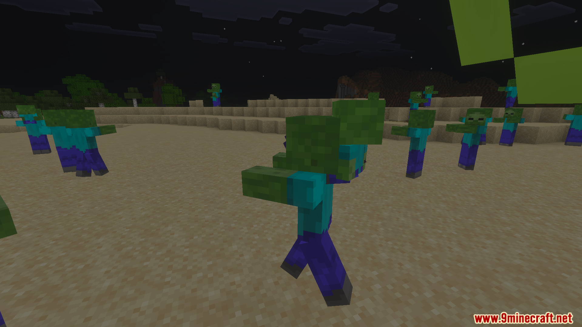 Multiple zombies of different sizes roaming a sandy beach under the night sky