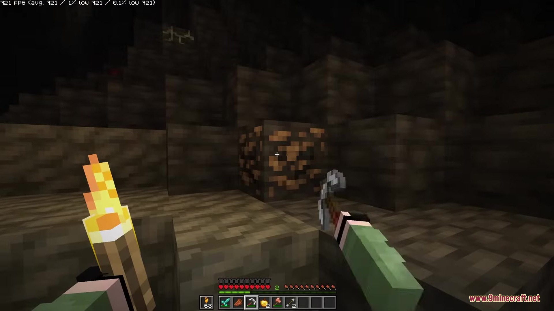 Hyper Punchy Resource Pack Screenshot 1 Player holding a torch and pickaxe while looking at iron ore