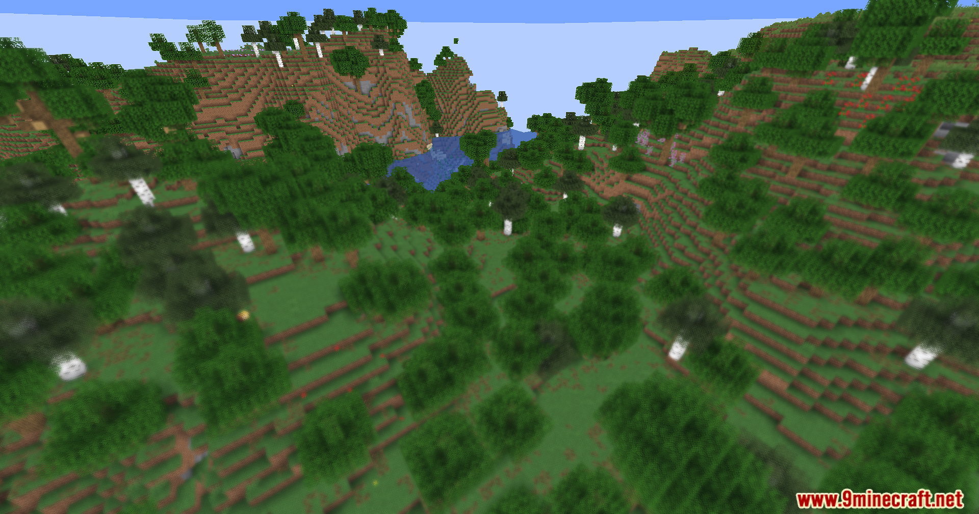 A hilly Minecraft landscape with a blurred foreground and clear background