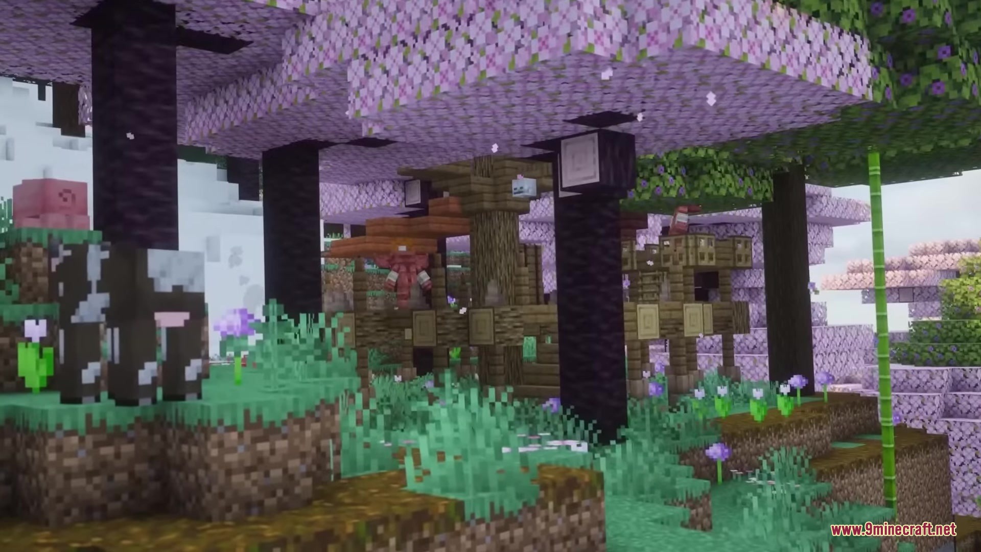 Hyrule Terrors Mod Screenshot 13 A cow stands near pink cherry blossom trees and a wooden structure in Minecraft