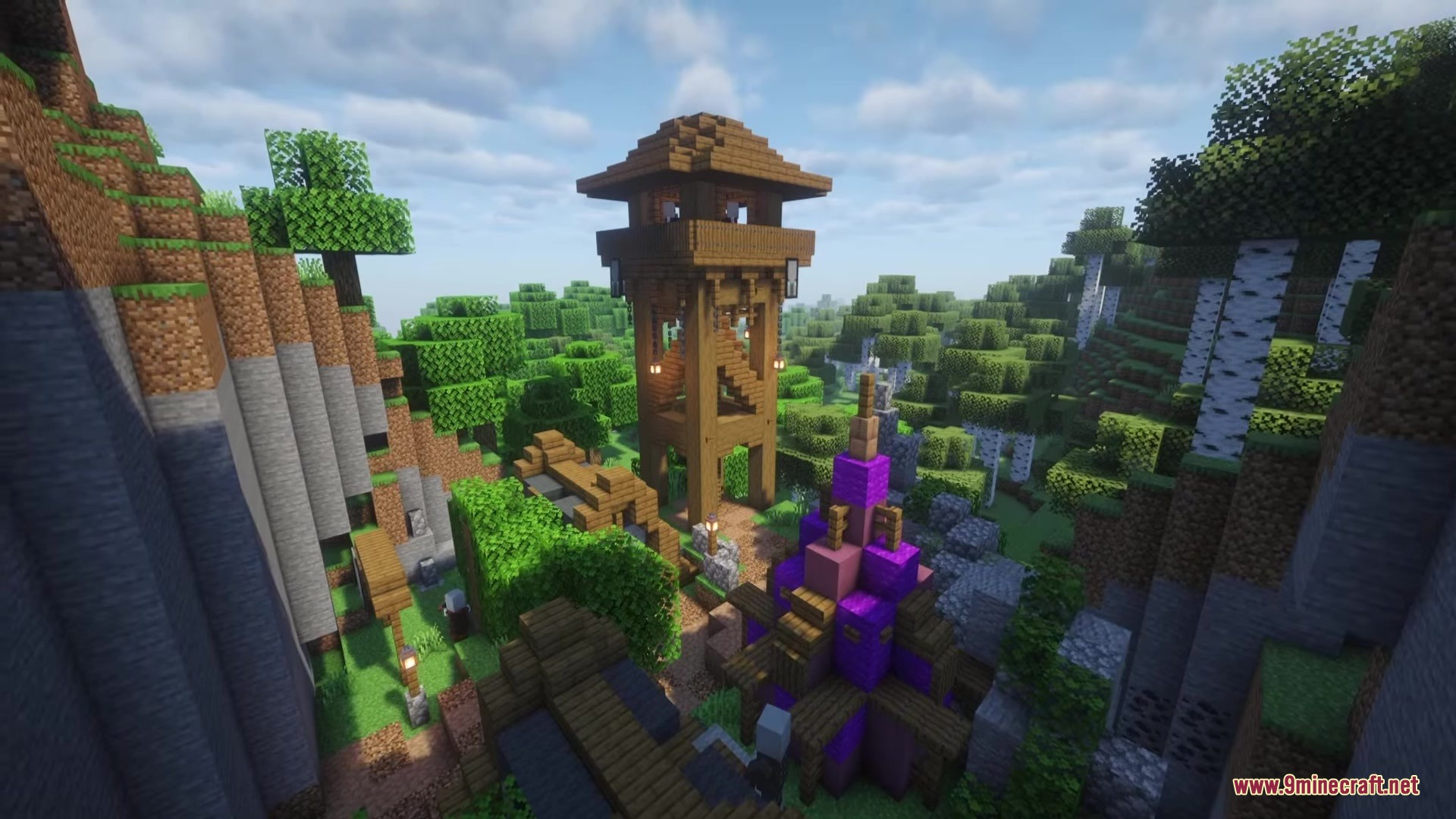 Illager Structures Mod Screenshot 8 A tall wooden watchtower stands in a lush green forest valley