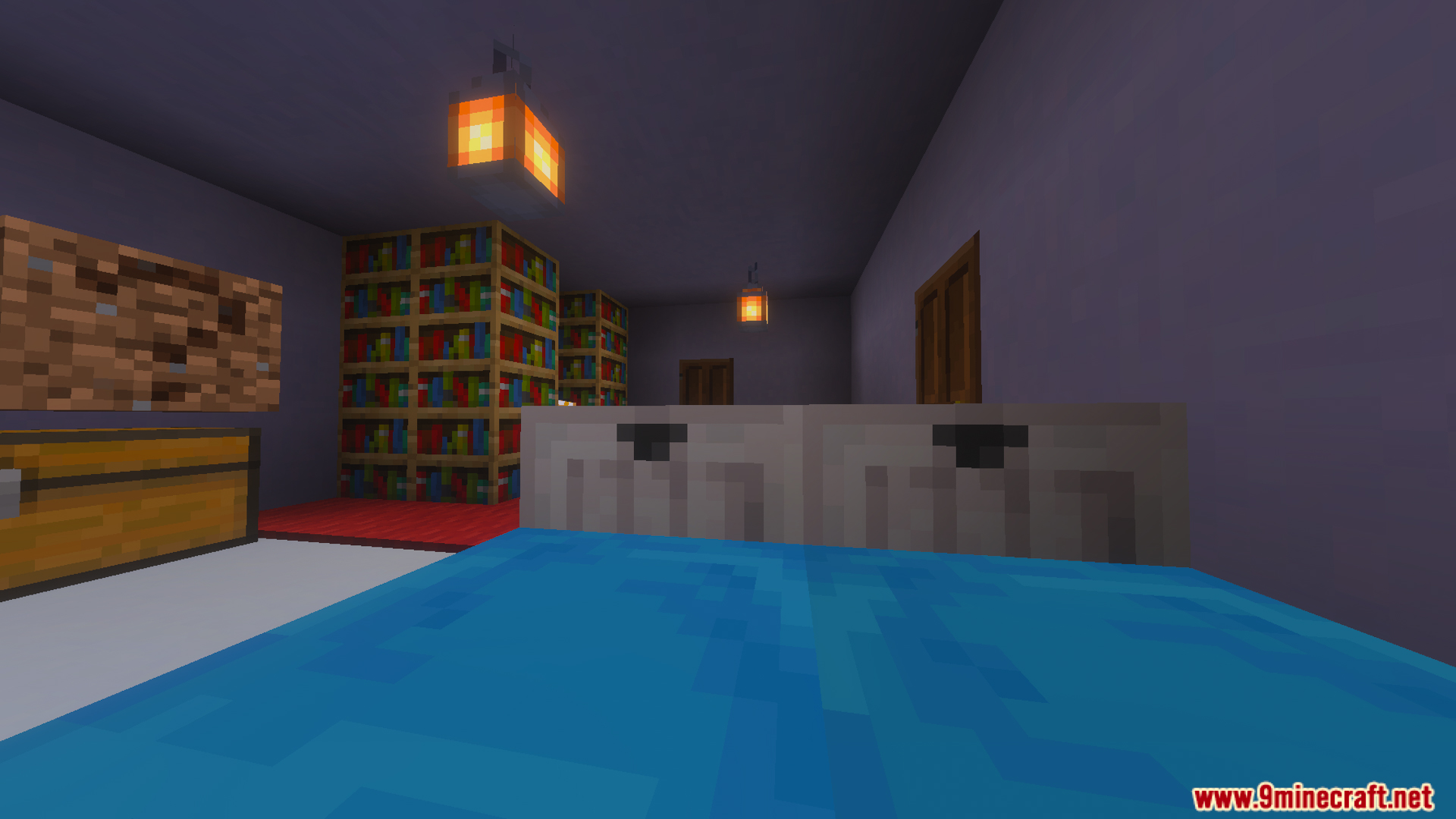 Cozy bedroom interior featuring a blue bed wooden bookshelves and hanging lanterns