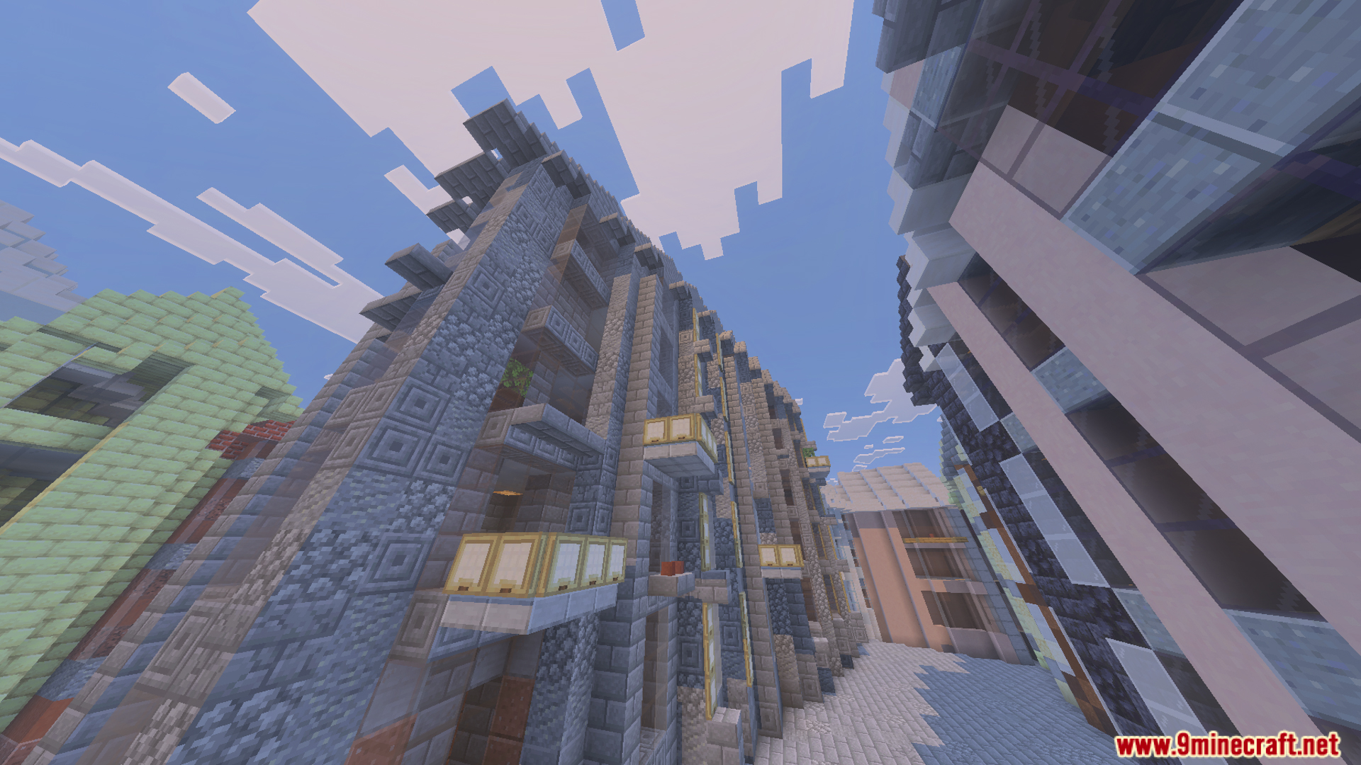 Low angle view of tall stone buildings with balconies in a city street