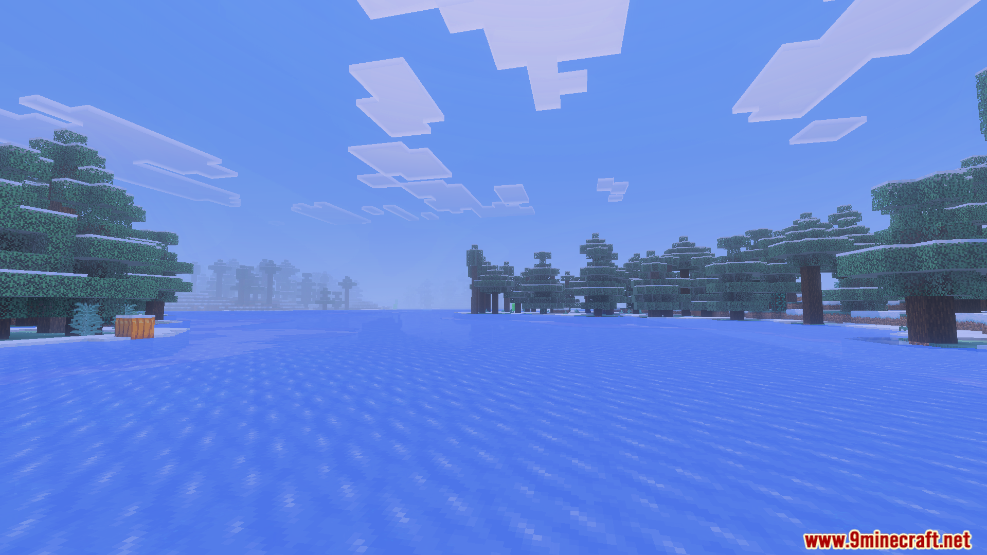 Windy frozen ocean biome with snowy spruce trees and clear blue sky