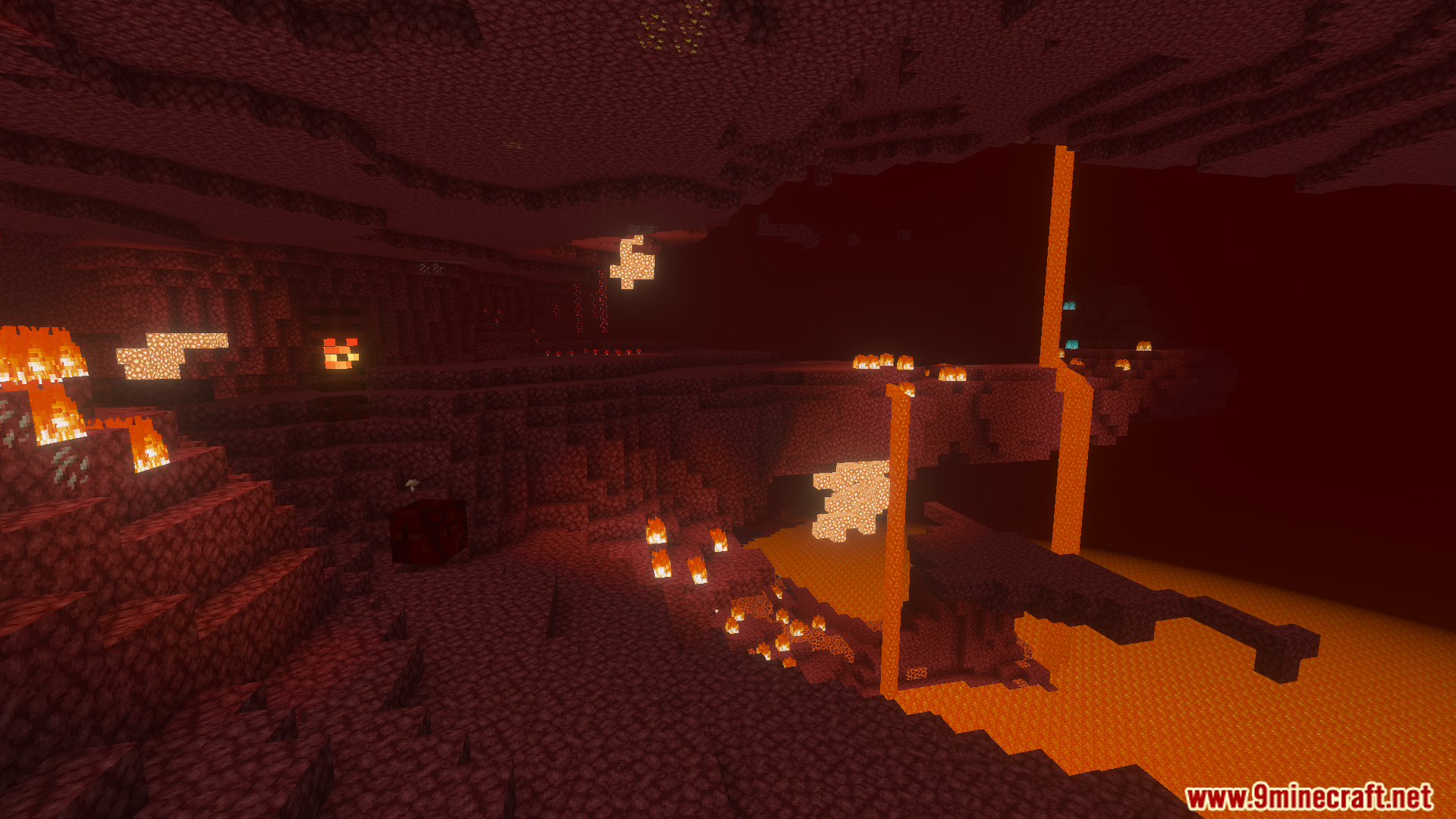 Red netherrack landscape in the Nether with lava falls and glowing fire