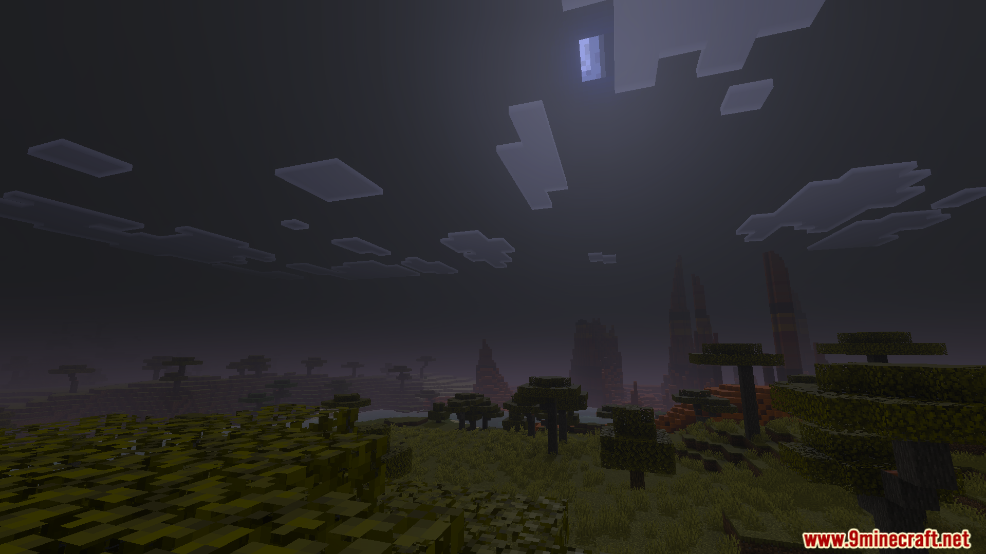 Dark night sky with clouds over a savanna landscape in Minecraft Bedrock