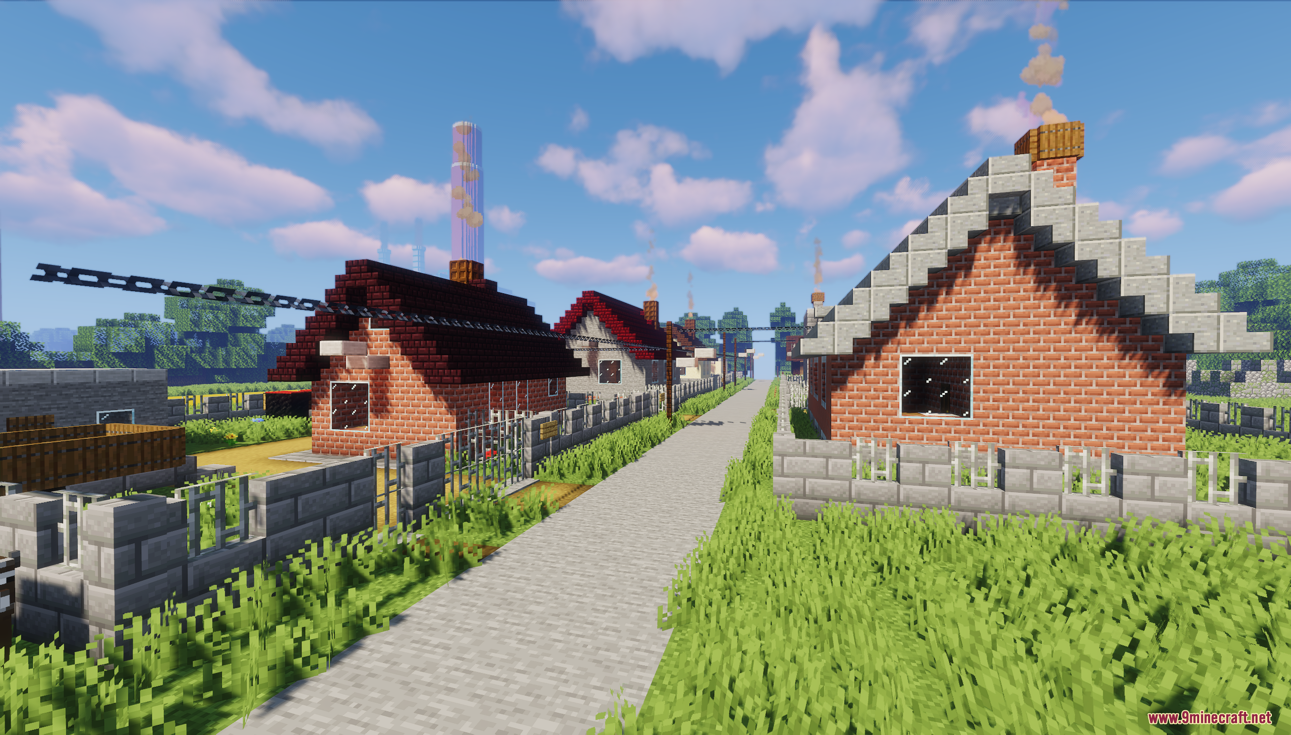A street lined with brick houses and stone fences under blue skies