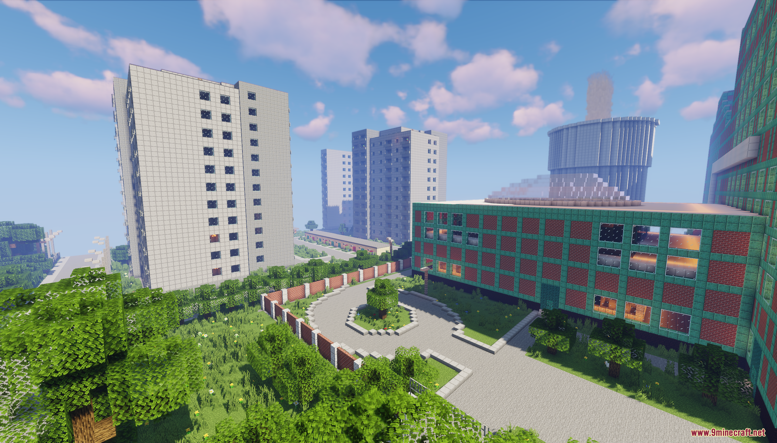 Tall white apartment buildings and a green brick structure in Jaworowiec City