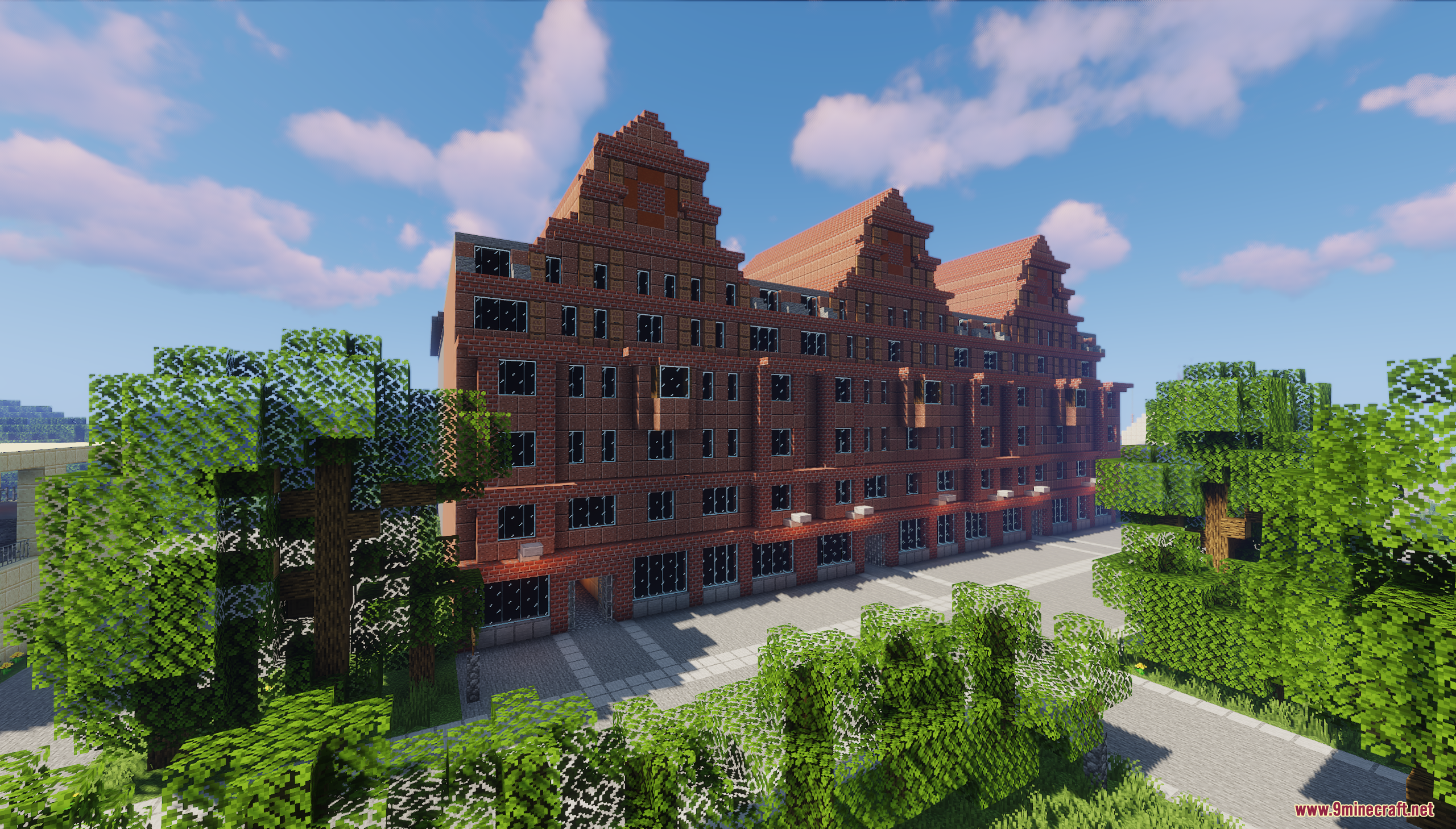 A large red brick apartment building with gabled roofs in Jaworowiec City