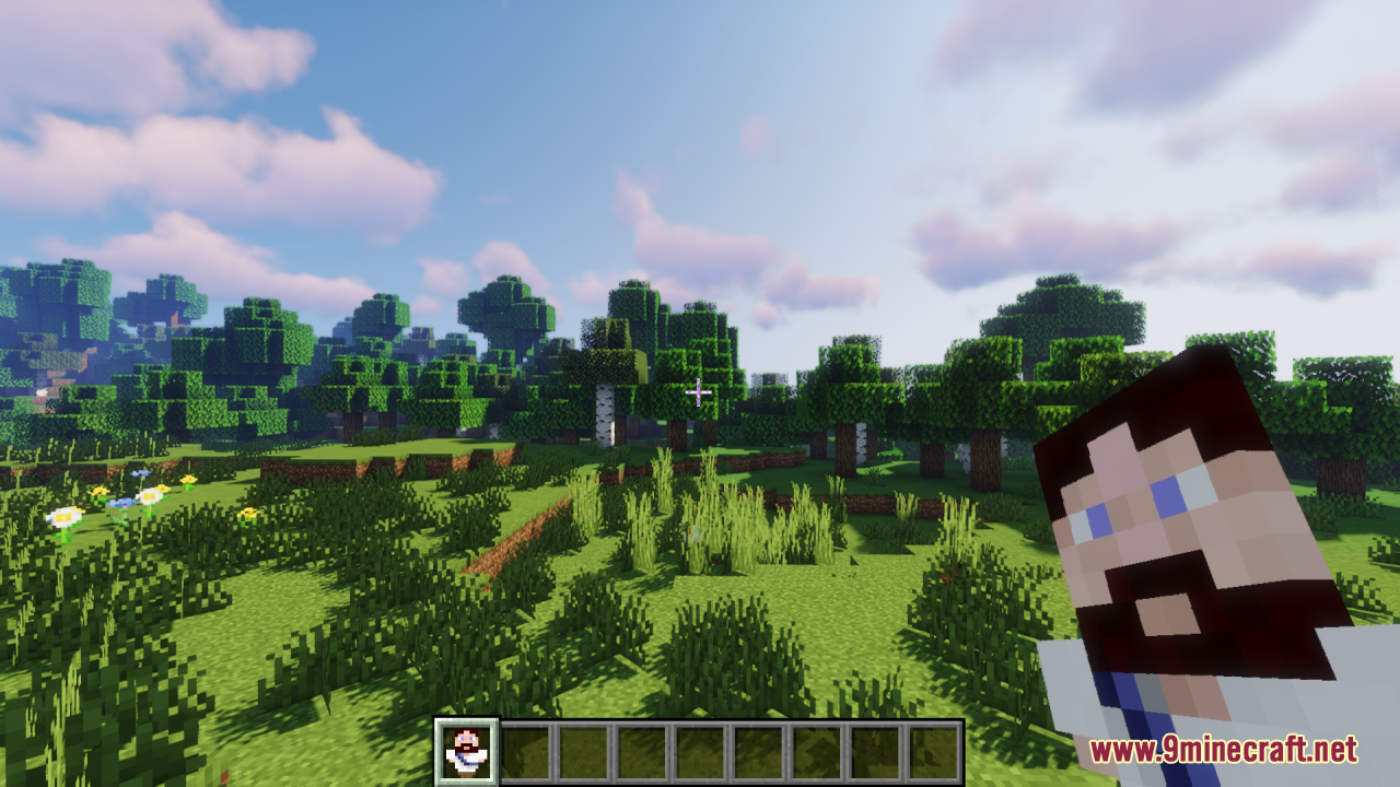 Minecraft landscape showing the Jesus Totem of Undying in the player hotbar