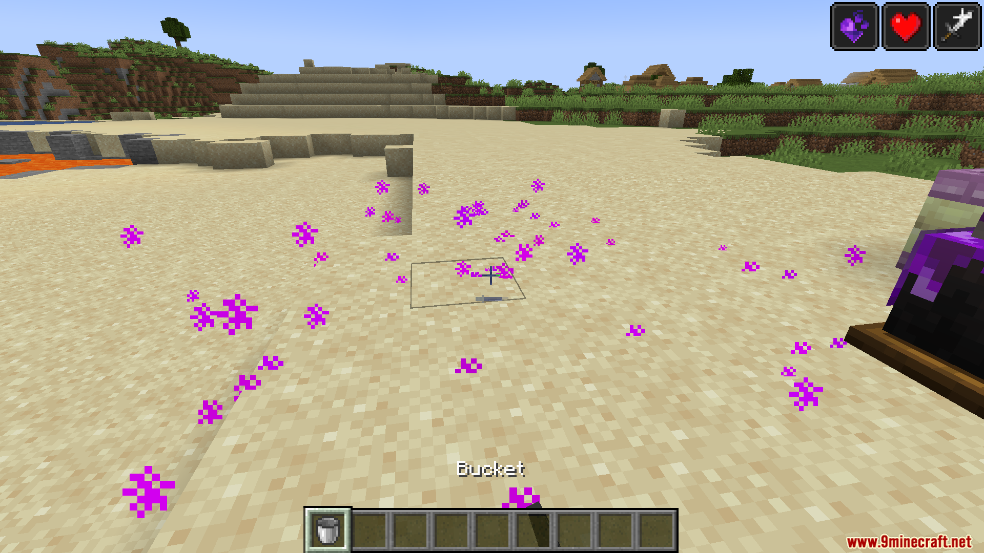 Kaleidoscope End Mod Screenshot 11 Purple particles on sand near a cauldron and a bucket