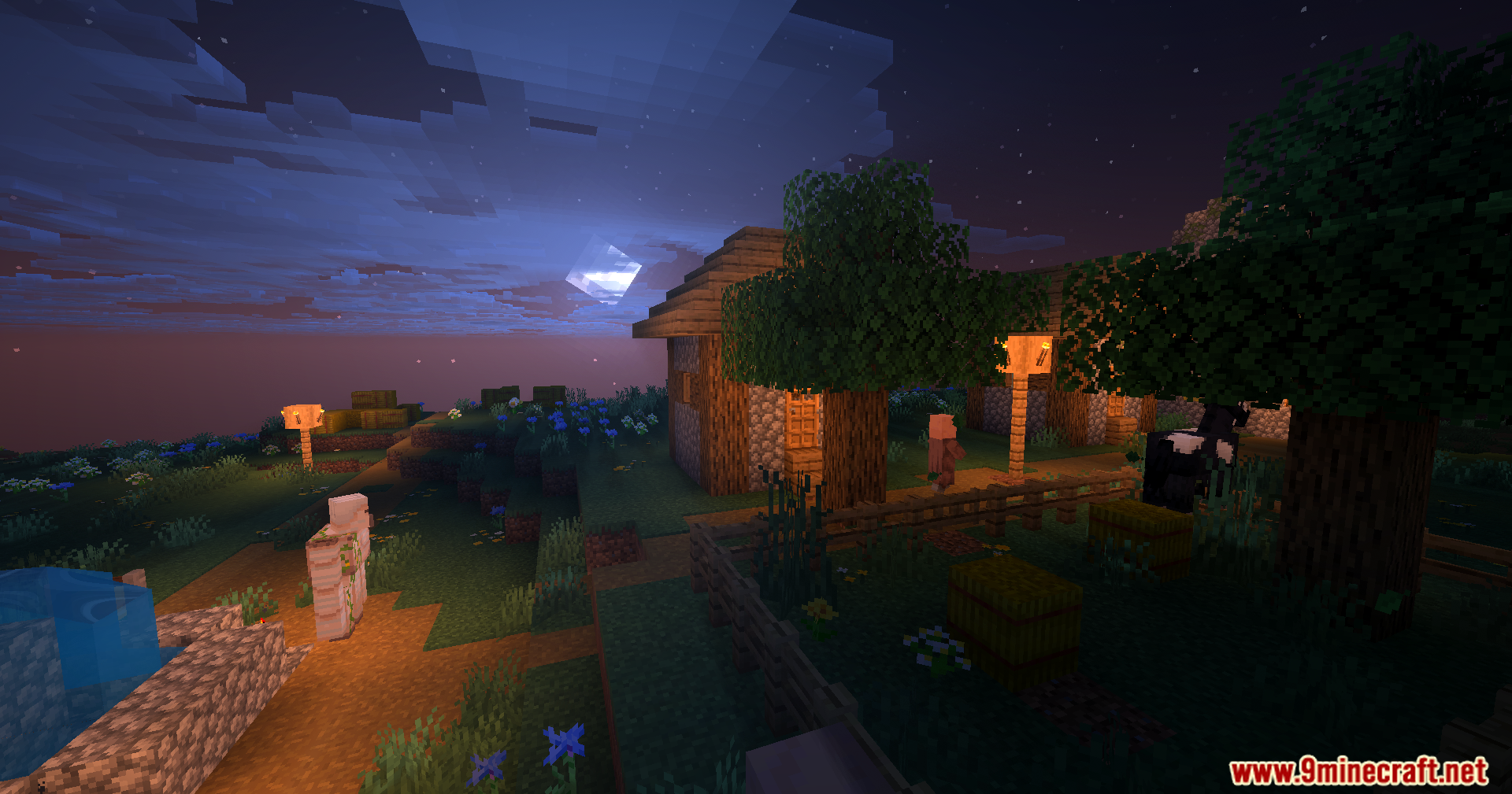 Karma Shaders Screenshot 1 A peaceful Minecraft village at night with glowing lanterns and iron golem