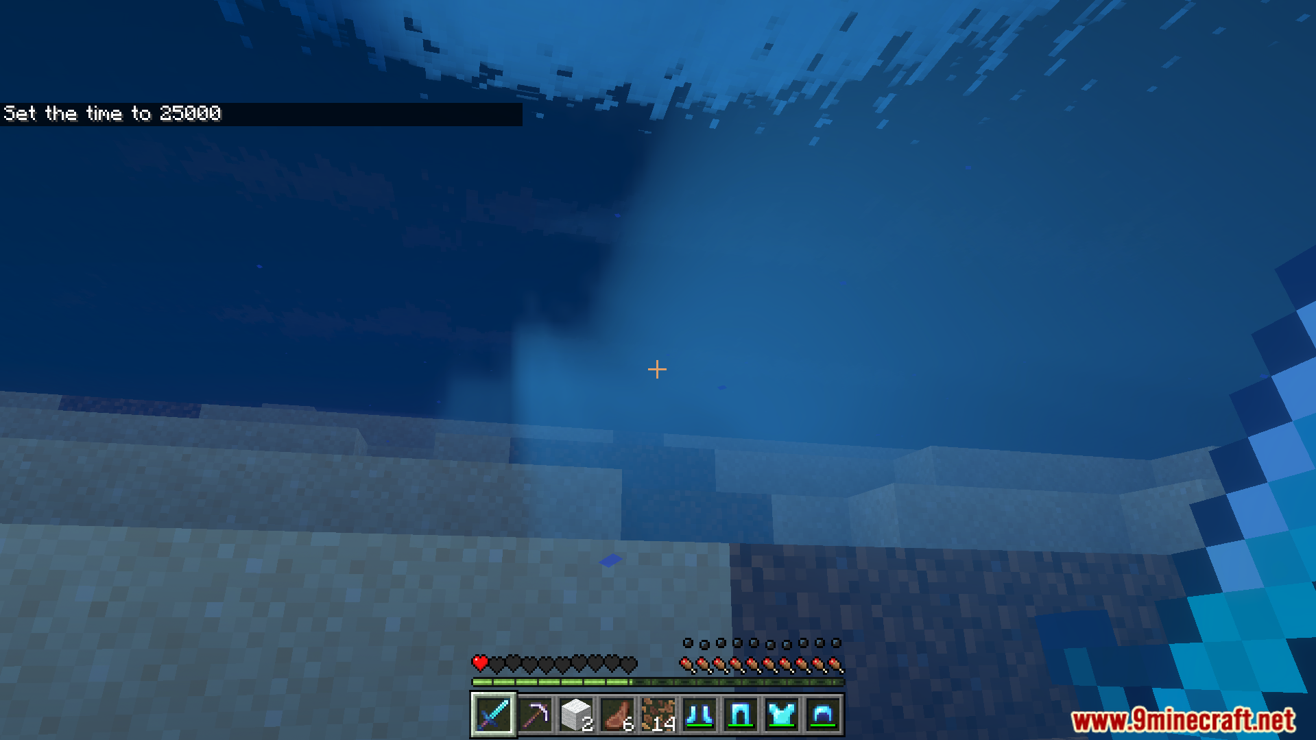 Player swimming underwater while holding a diamond sword and a full inventory