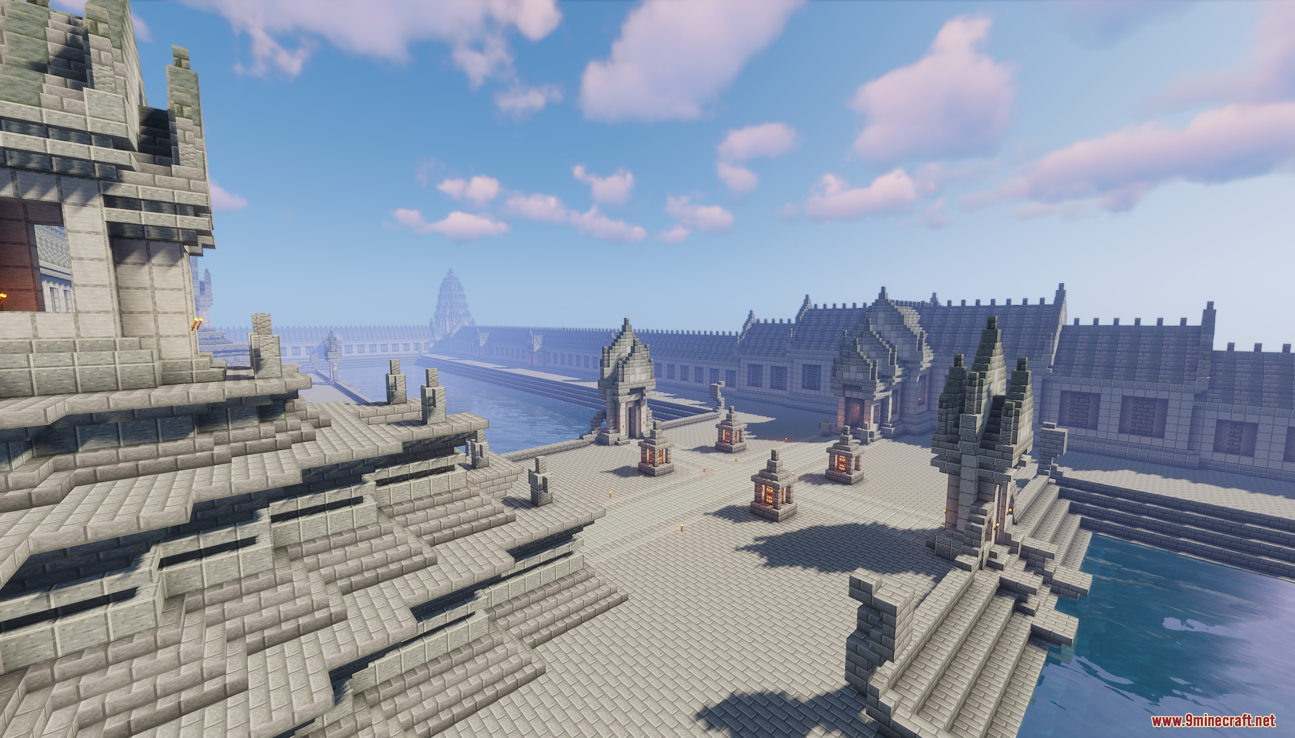 Khmer Temple Map Screenshot 5 Stone towers and detailed walkways overlooking a calm water moat in Minecraft
