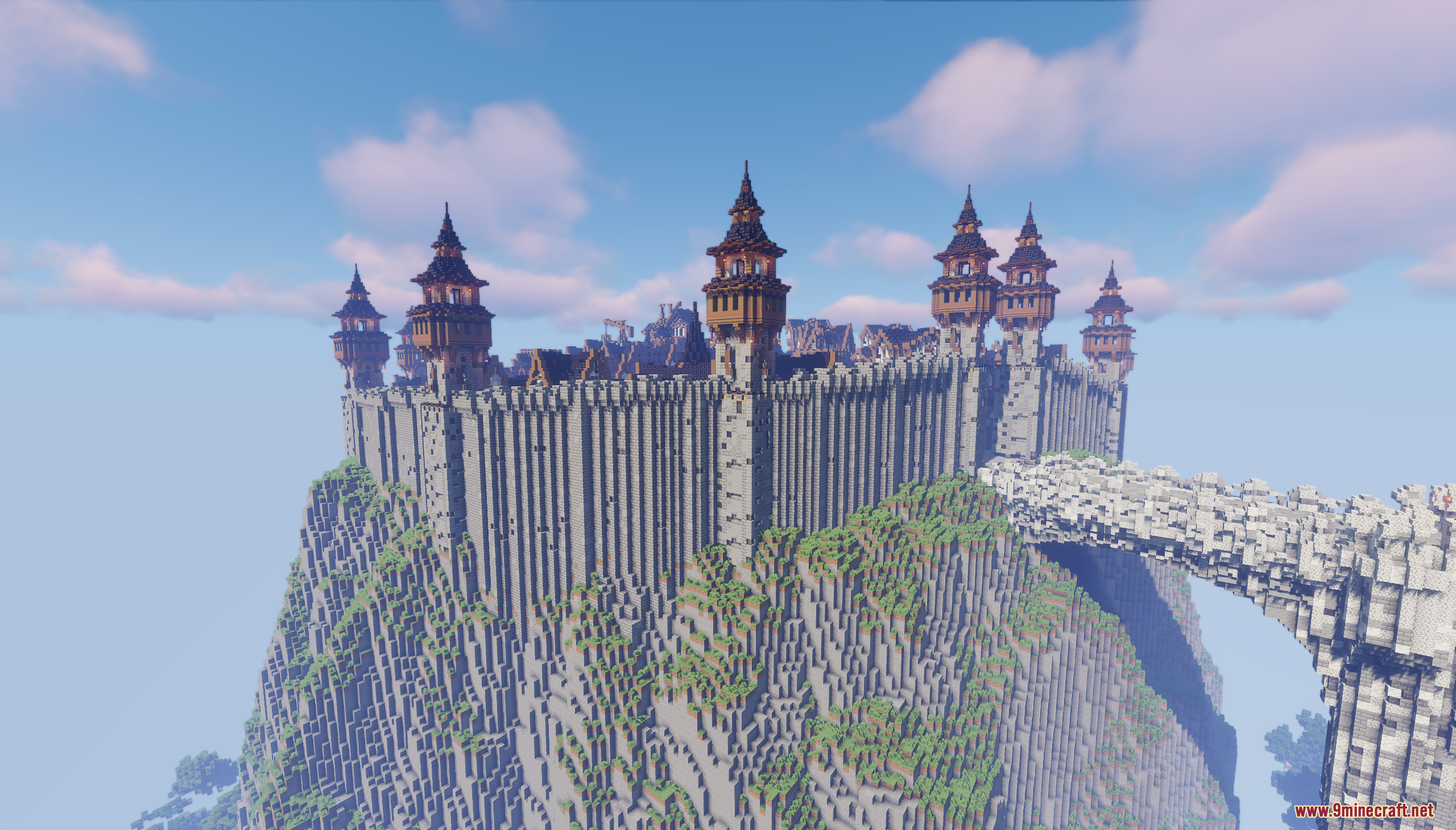 A massive stone fortress with many wooden towers built on a steep cliff
