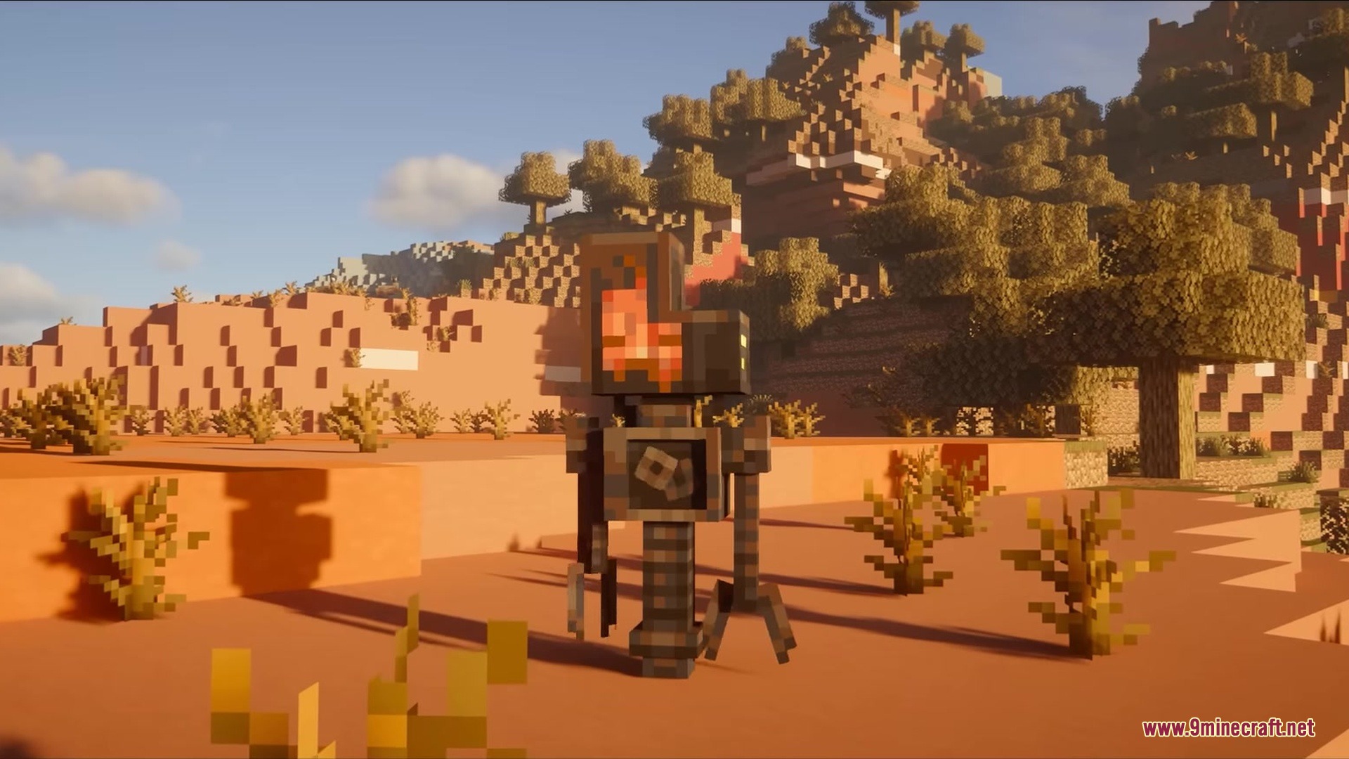 A slender mechanical robot with a glowing head stands in a desert