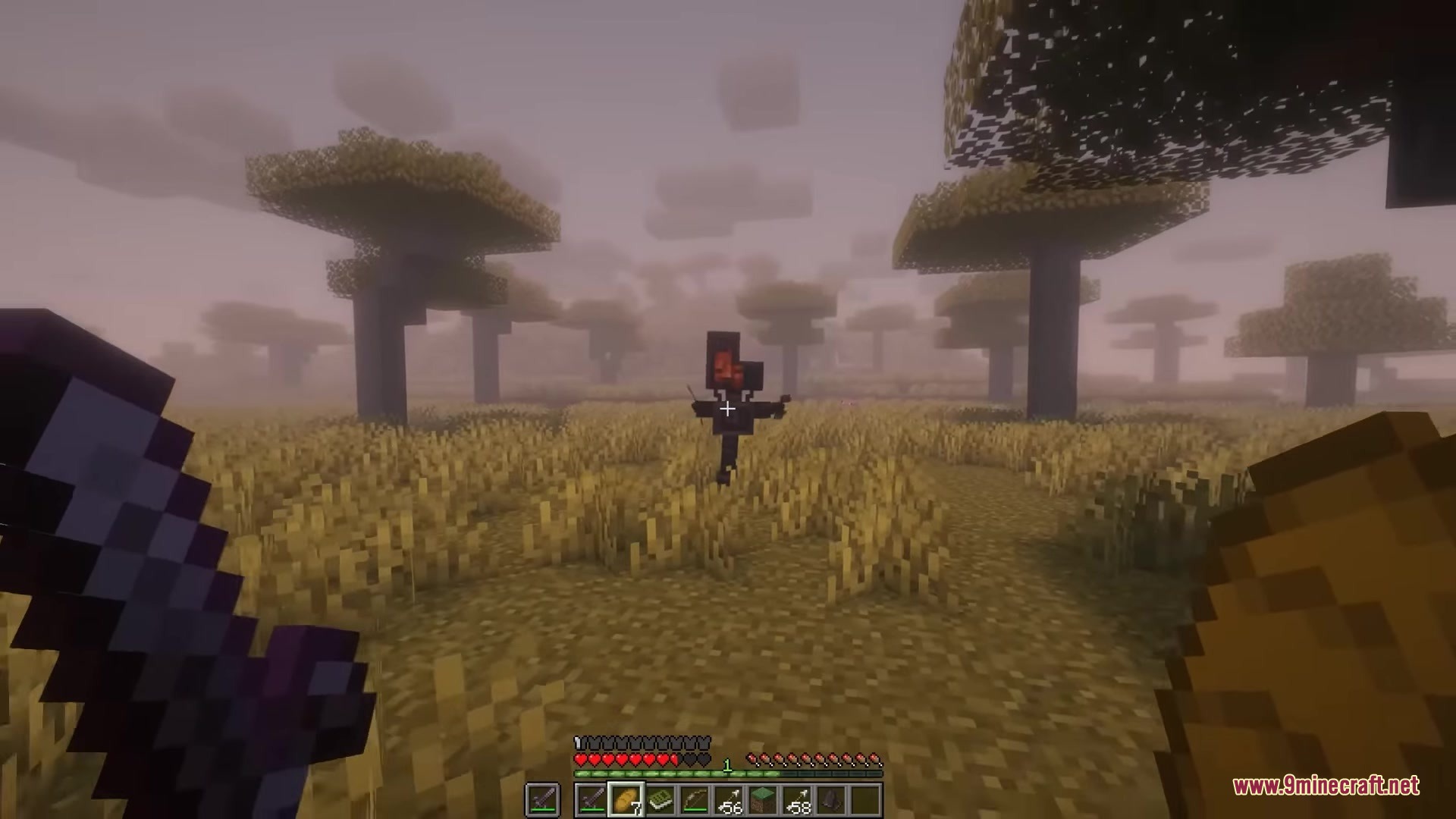 A player spots a robotic enemy standing in a foggy savanna biome