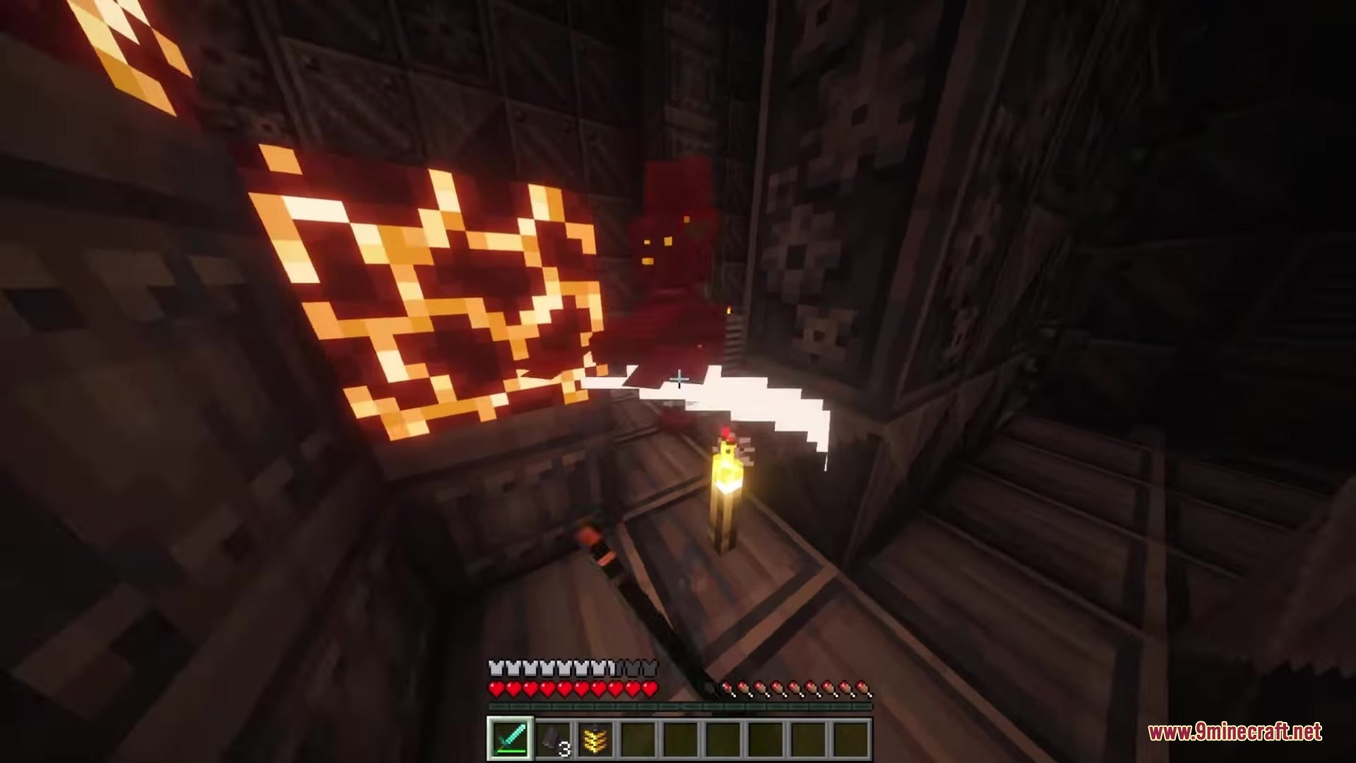 Player uses a sword to fight a red robotic enemy in tech ruins