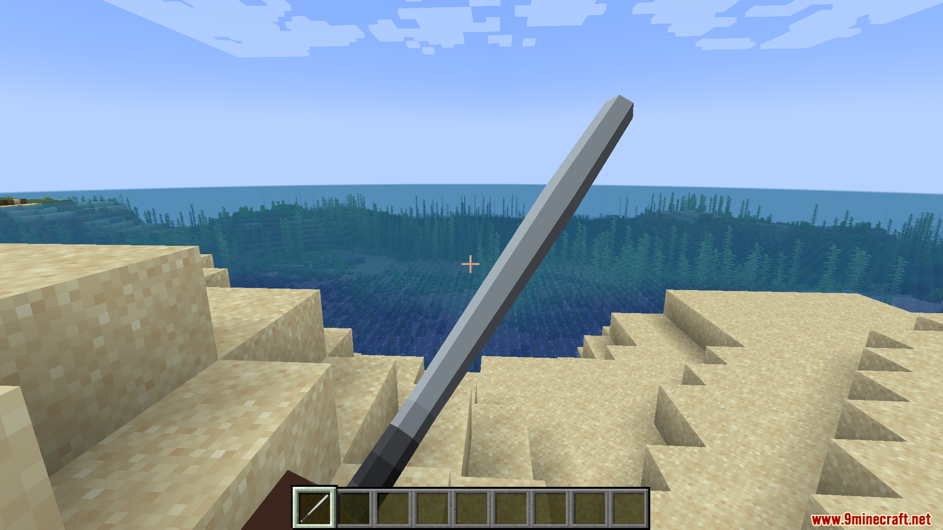Player wielding an M9 Bayonet knife while looking at the blue ocean