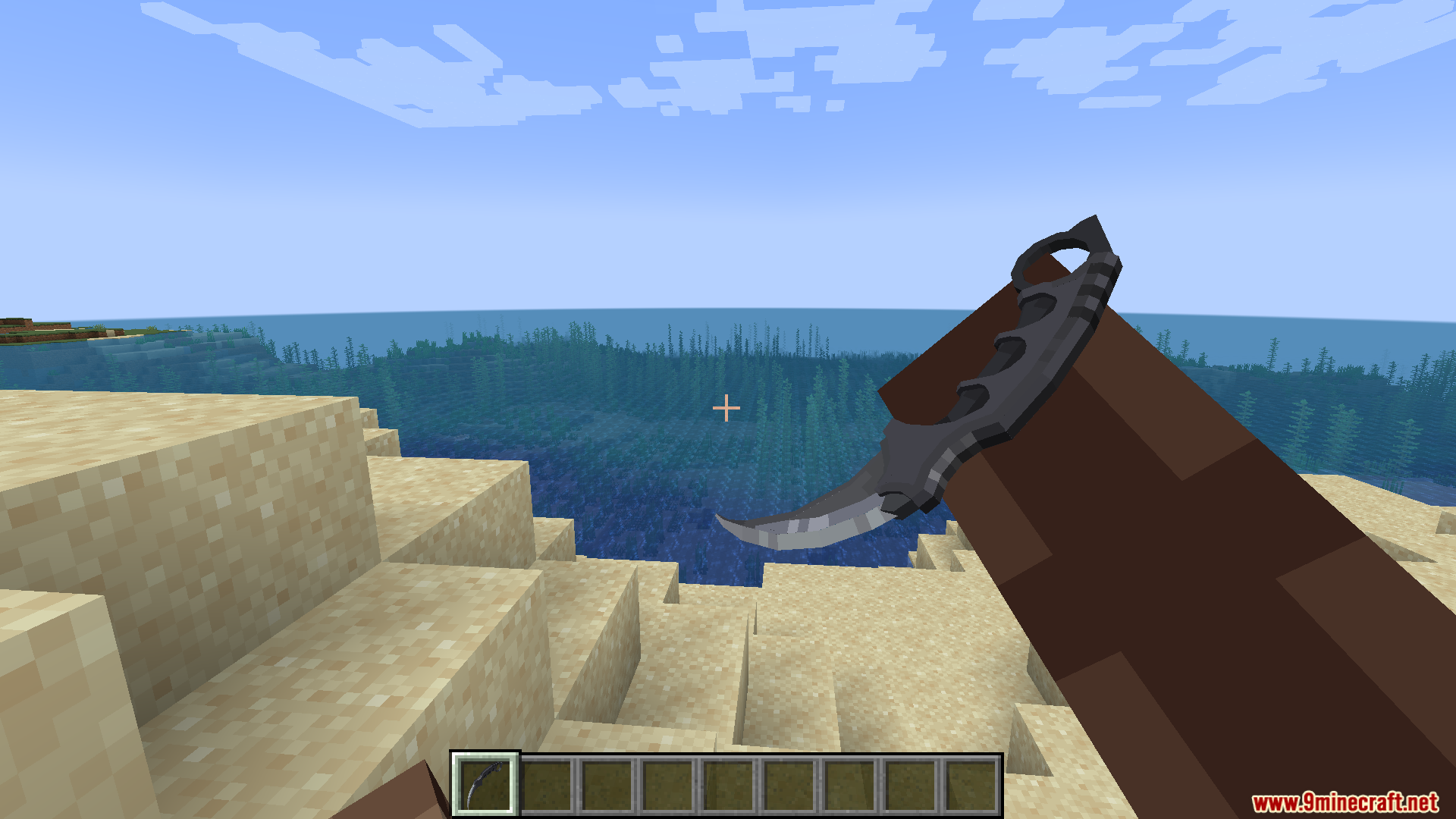 Player holding a Karambit knife from the CS2 Knifes Pack on a beach