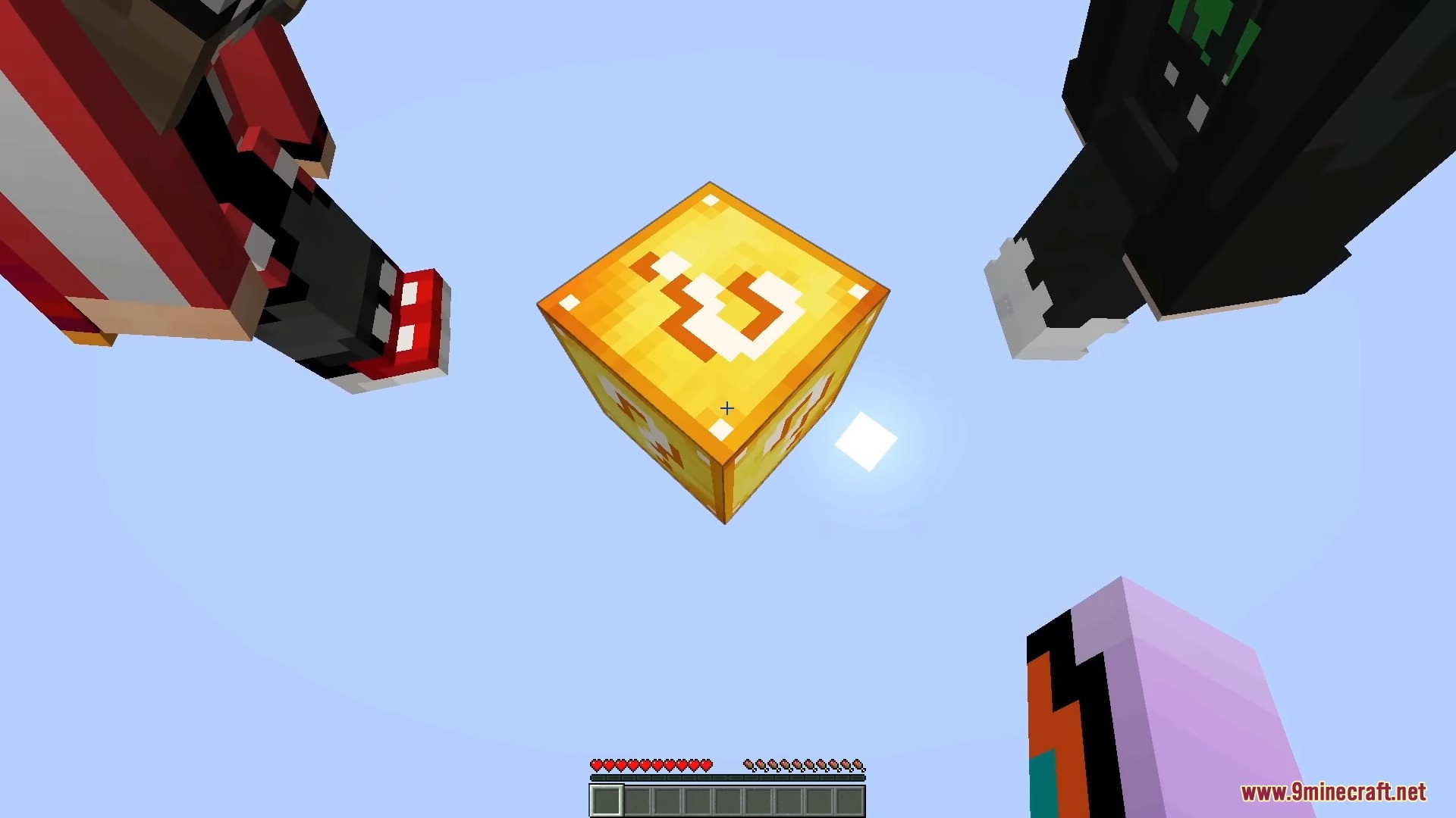 Multiple players look up at a mysterious golden block floating in the sky