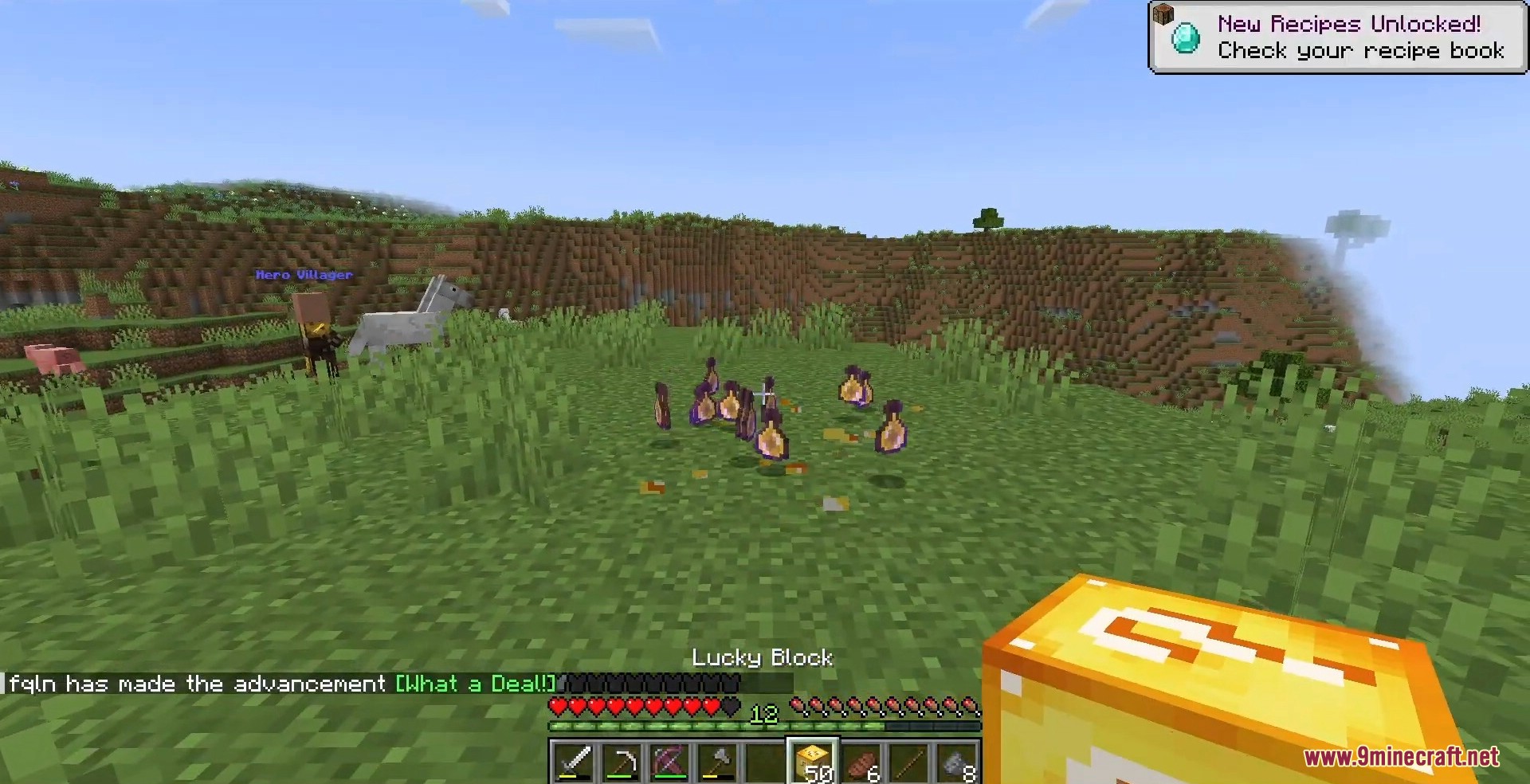 Several purple potion bottles float on the ground as newly spawned loot