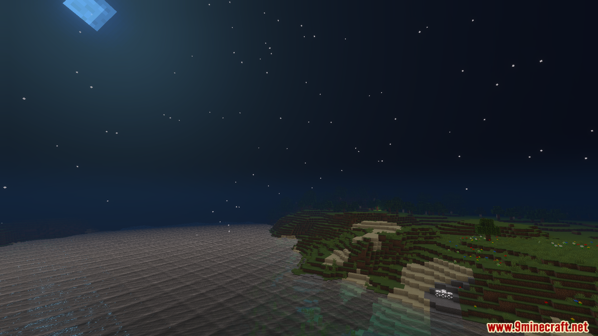 Beautiful night sky with stars and clear water along a grassy Minecraft shoreline