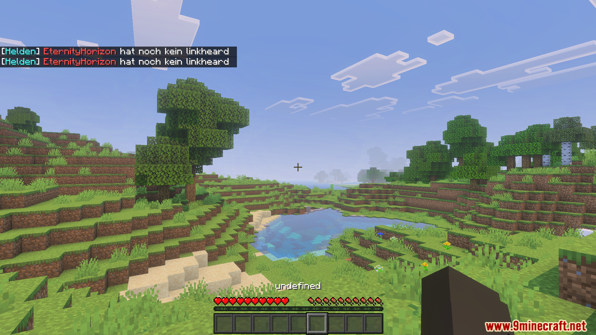 M Helden Addon Screenshot 4 Minecraft landscape showing chat messages for commands and player heart status
