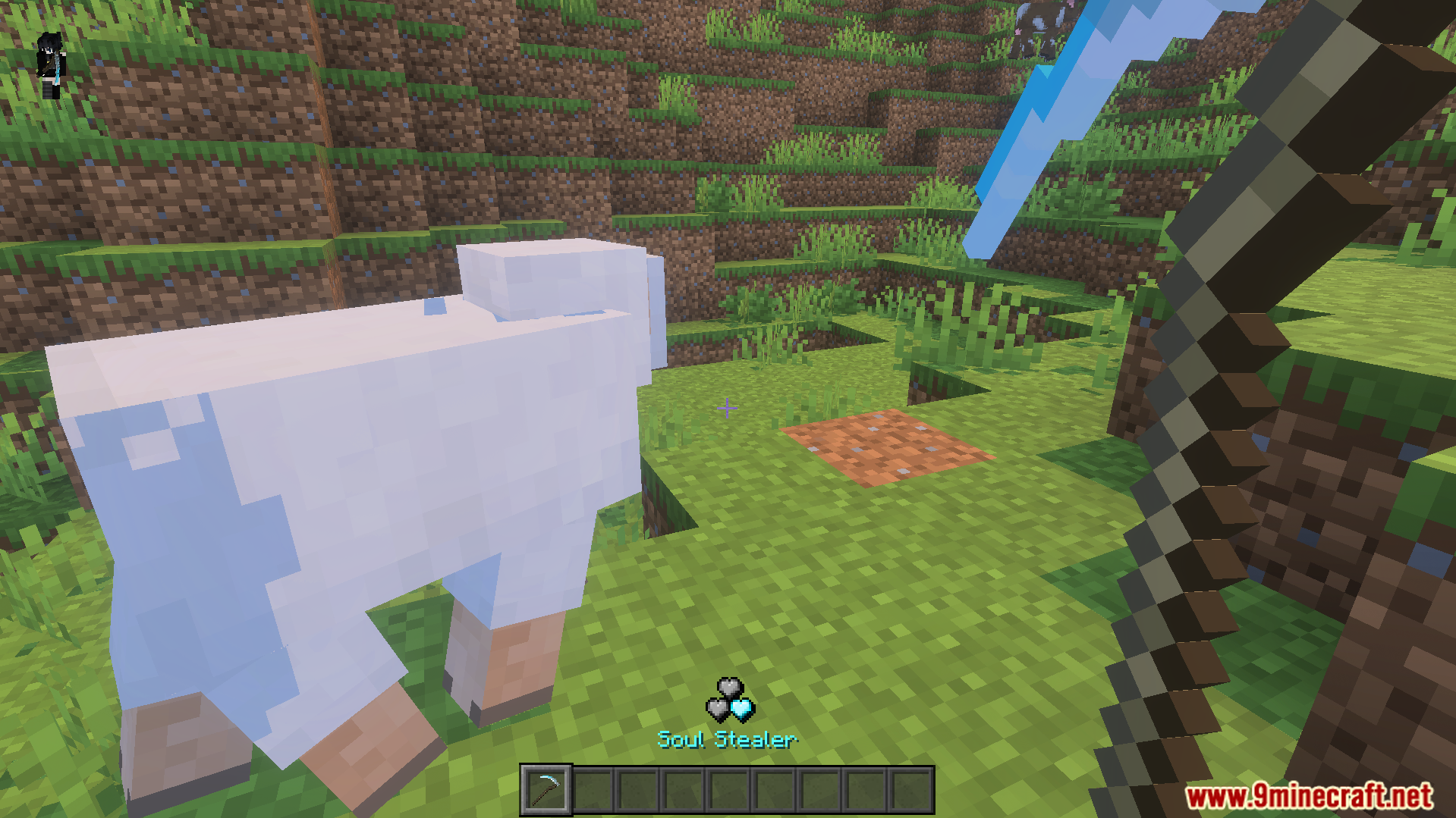 M Helden Addon Screenshot 7 Player holding a Soul Stealer weapon while looking at a white sheep