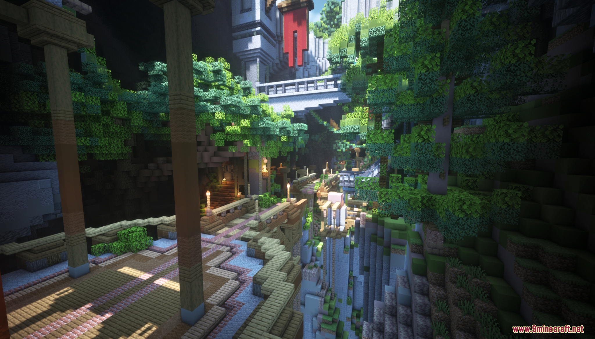 Stone bridges and pillars surrounded by lush green trees in a canyon