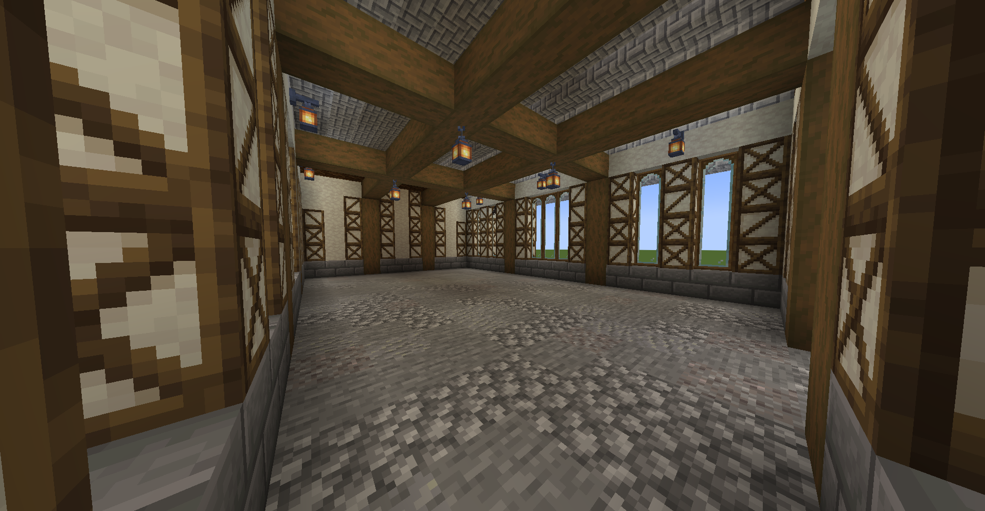 Spacious interior of a warehouse with stone floors and wooden ceiling beams