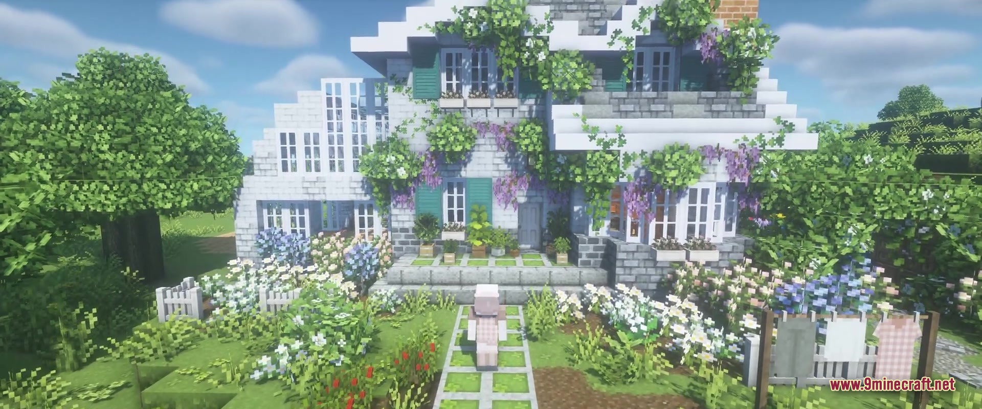 A player standing in front of a cozy white cottage with green shutters