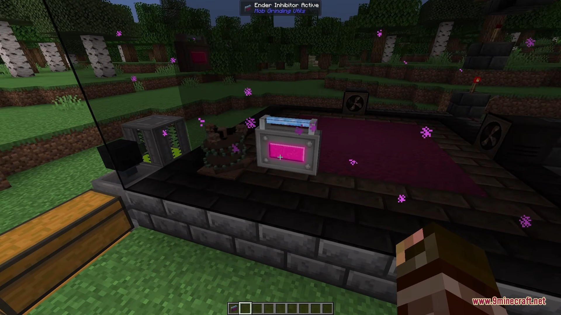 A player stands near a mob farm with a pink fluid tank