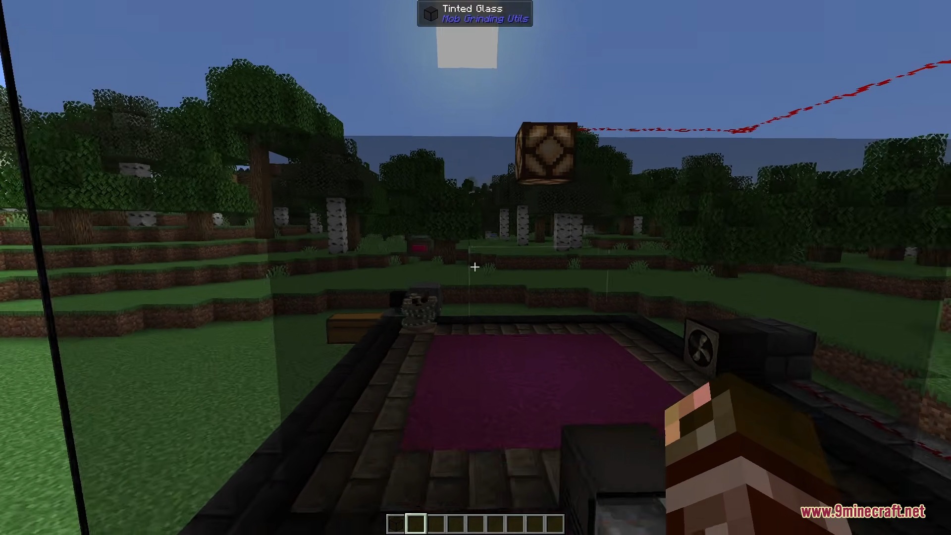 A player views a mob farm setup using blocks from Mob Grinding Utils