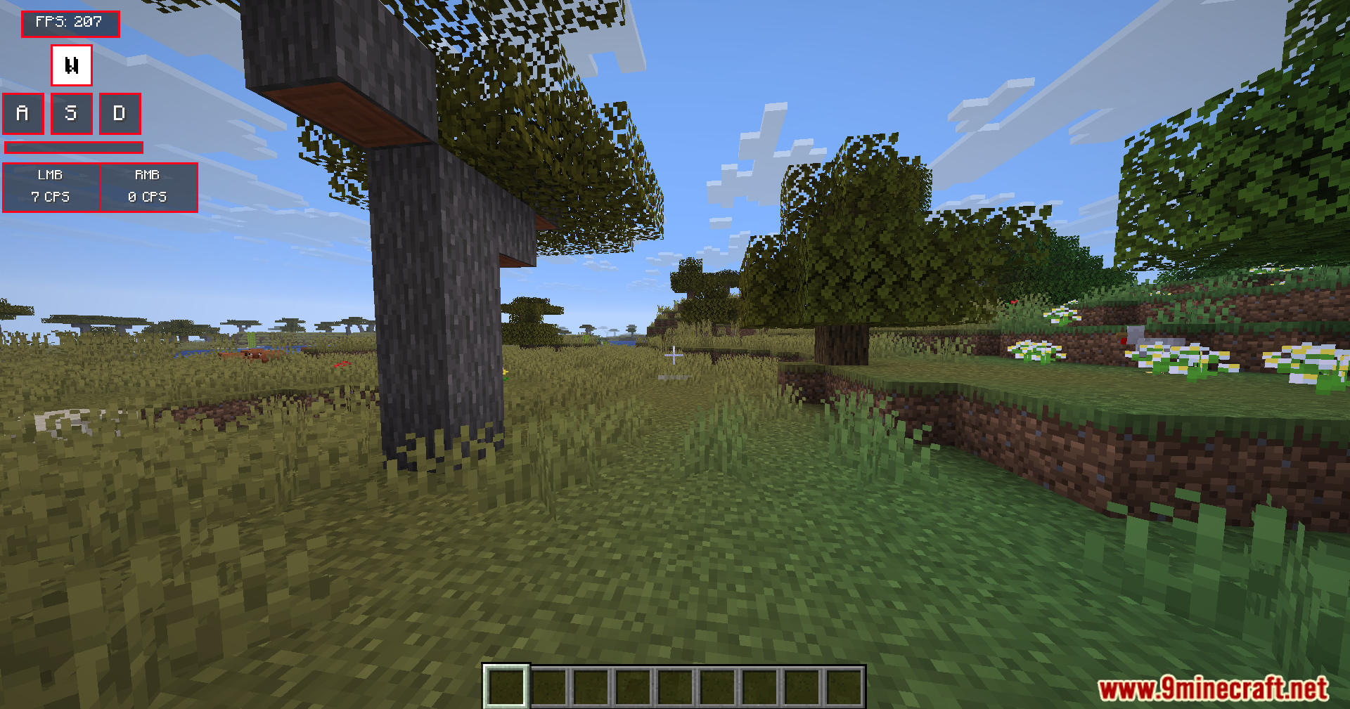 Modern Keystrokes Mod Screenshot 3 Red Modern Keystrokes HUD showing movement keys and clicks in a savanna biome