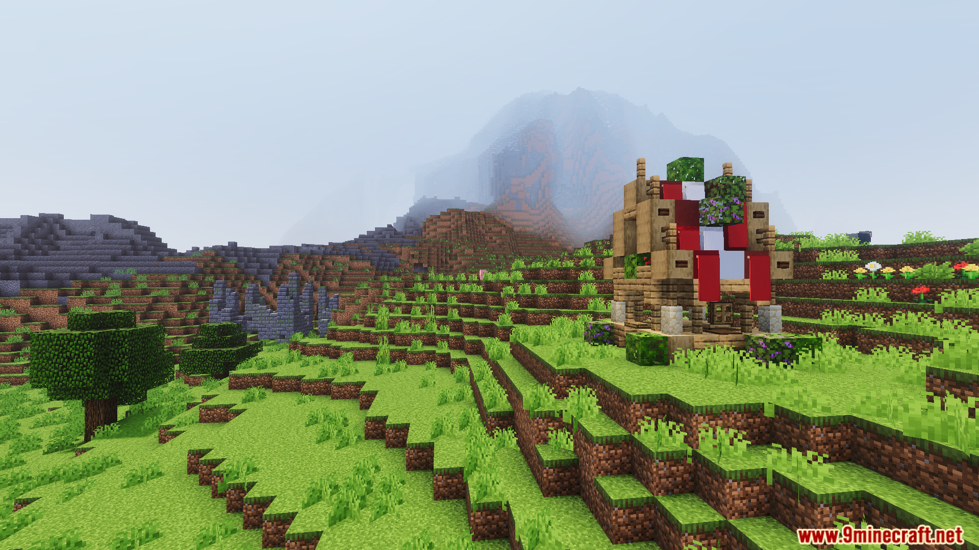 Moogs Voyager Structures Addon Screenshot 8 Small wooden structure with red banners on a hillside near a large mountain