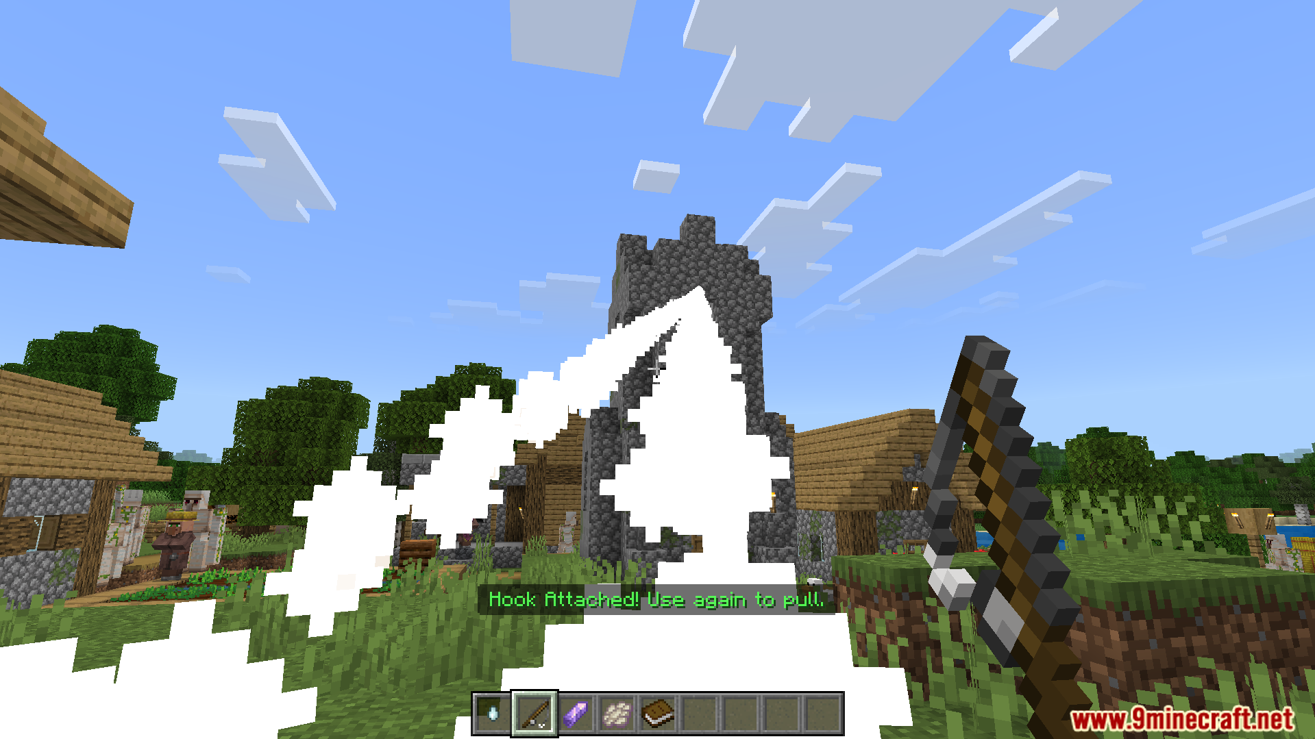 More Actions Addon Screenshot 5 Player shoots a grappling hook from More Actions Addon toward a village tower