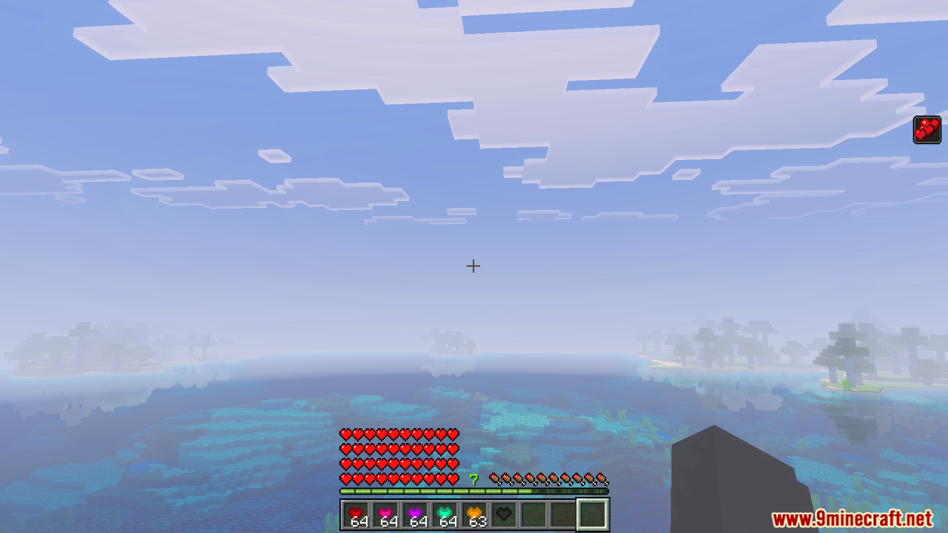 More Health Addon Screenshot 10 Player overlooking an ocean with four rows of red hearts and heart items