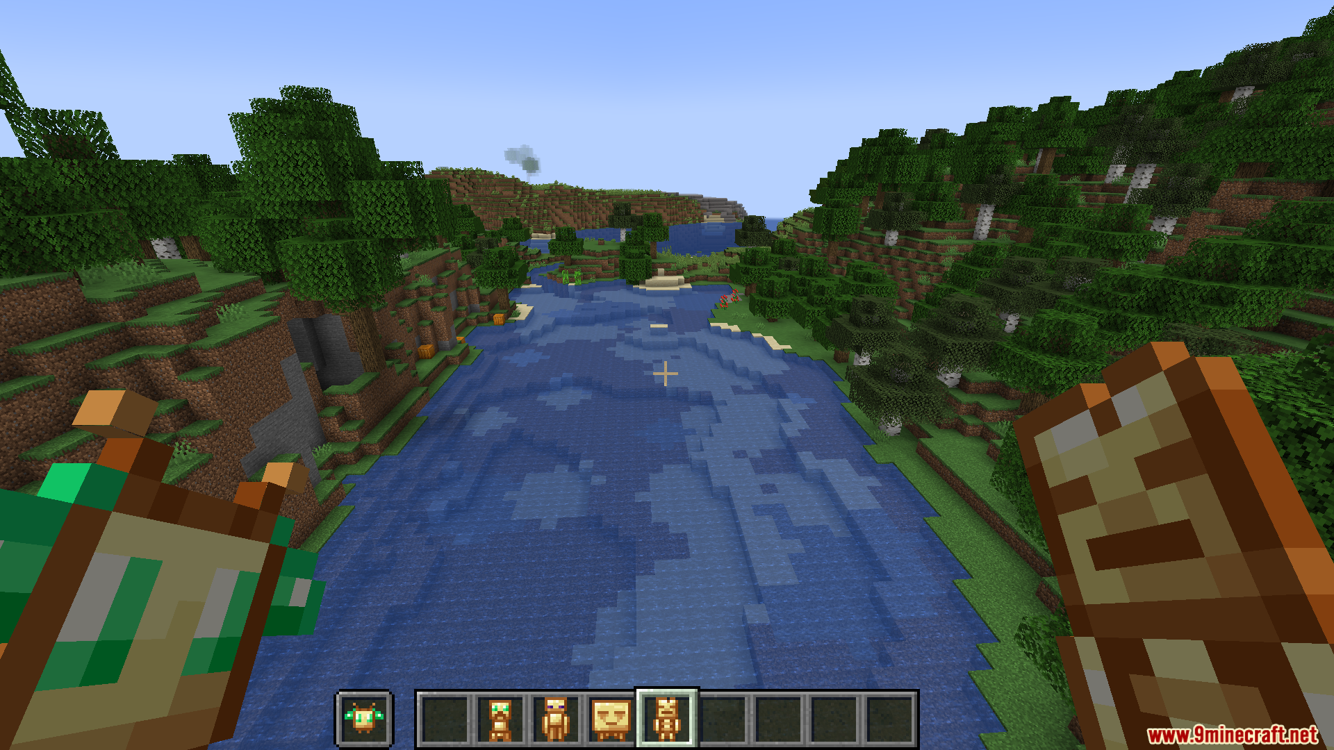 More Totems of Undying PT BR Translation Resource Pack Screenshot 5 A player holds unique totems while overlooking a scenic river valley in Minecraft