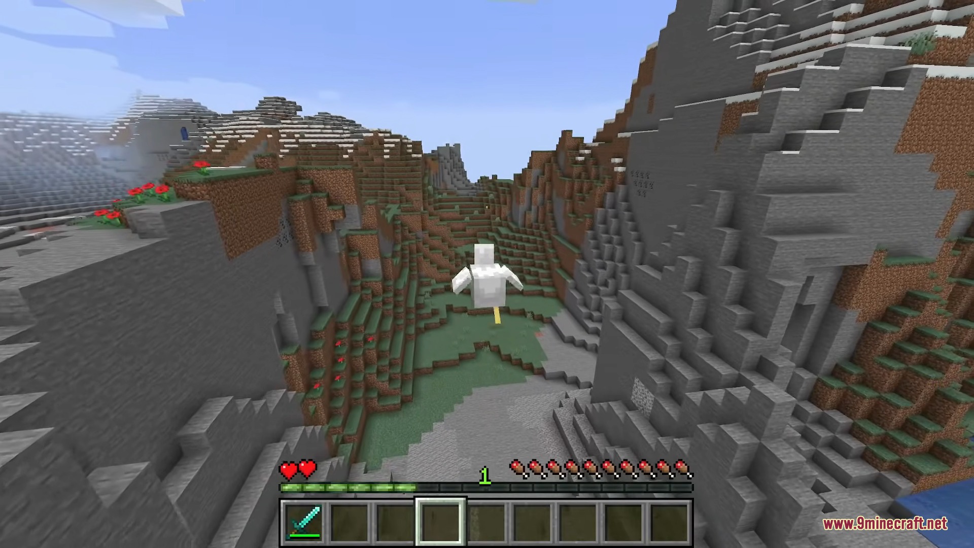 A player morphed into a chicken flies through a steep mountain valley