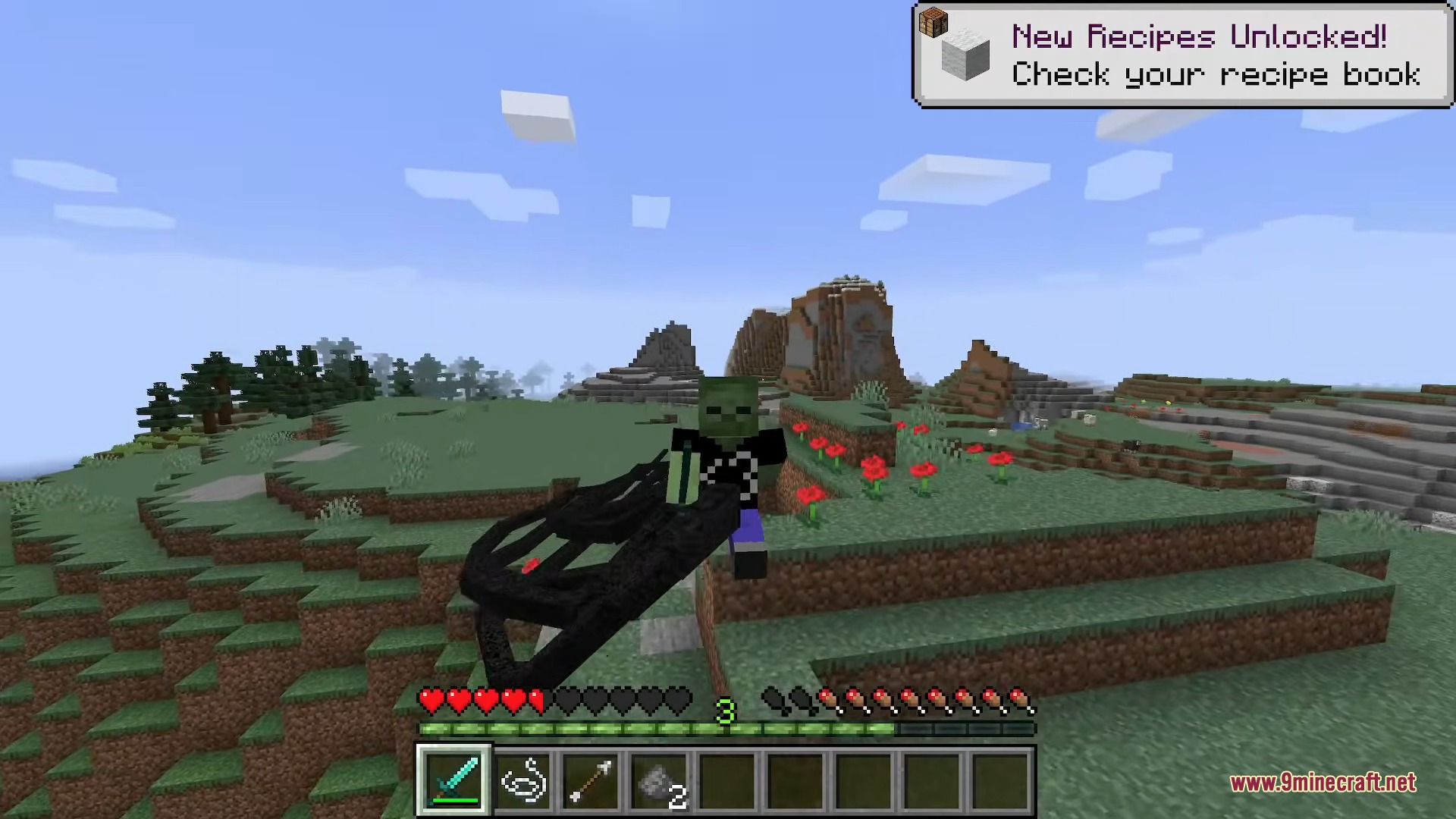 Player with a zombie head skin holding a large black morphing tool