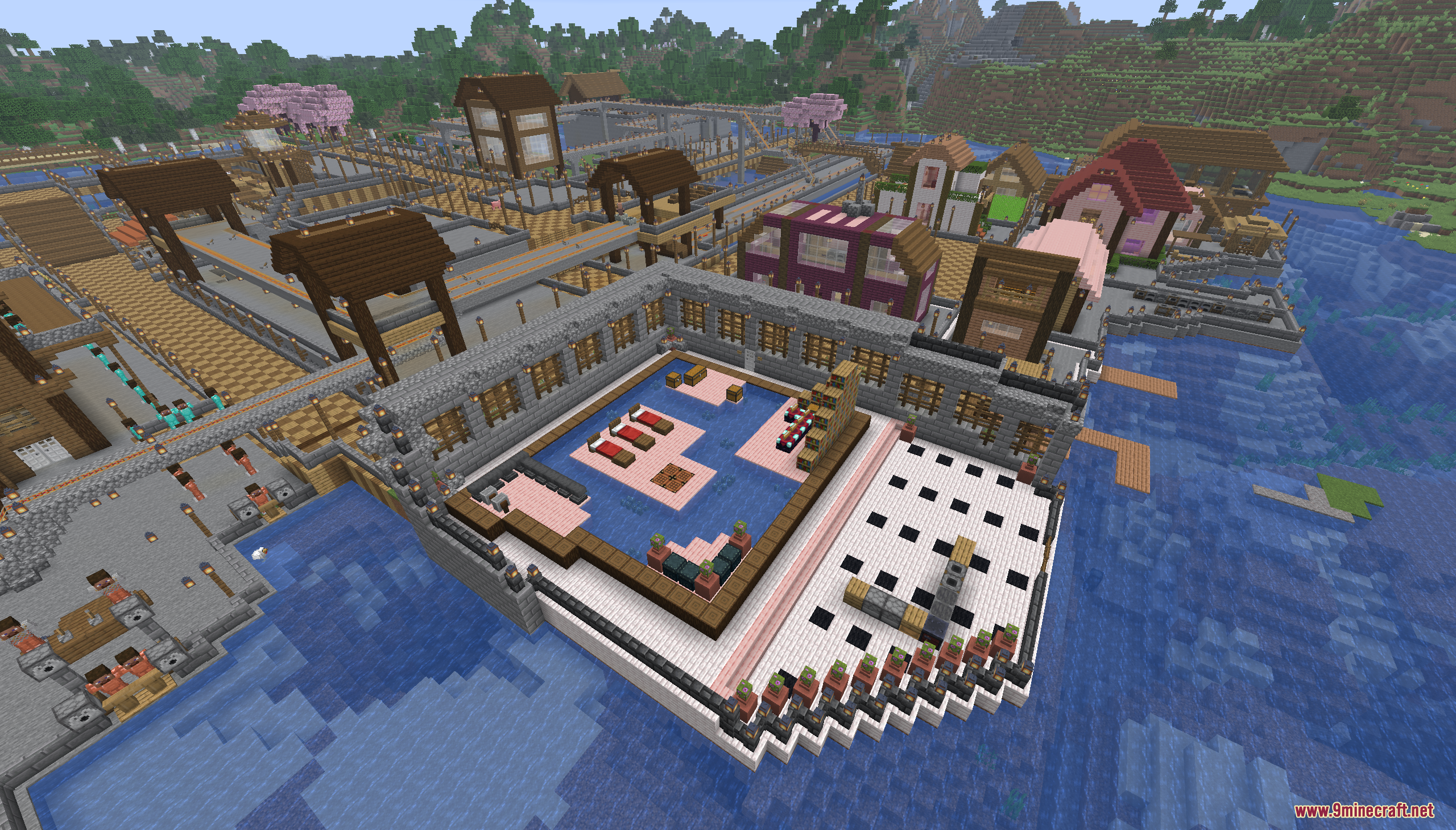Aerial view of a walled courtyard with villagers and houses on the island
