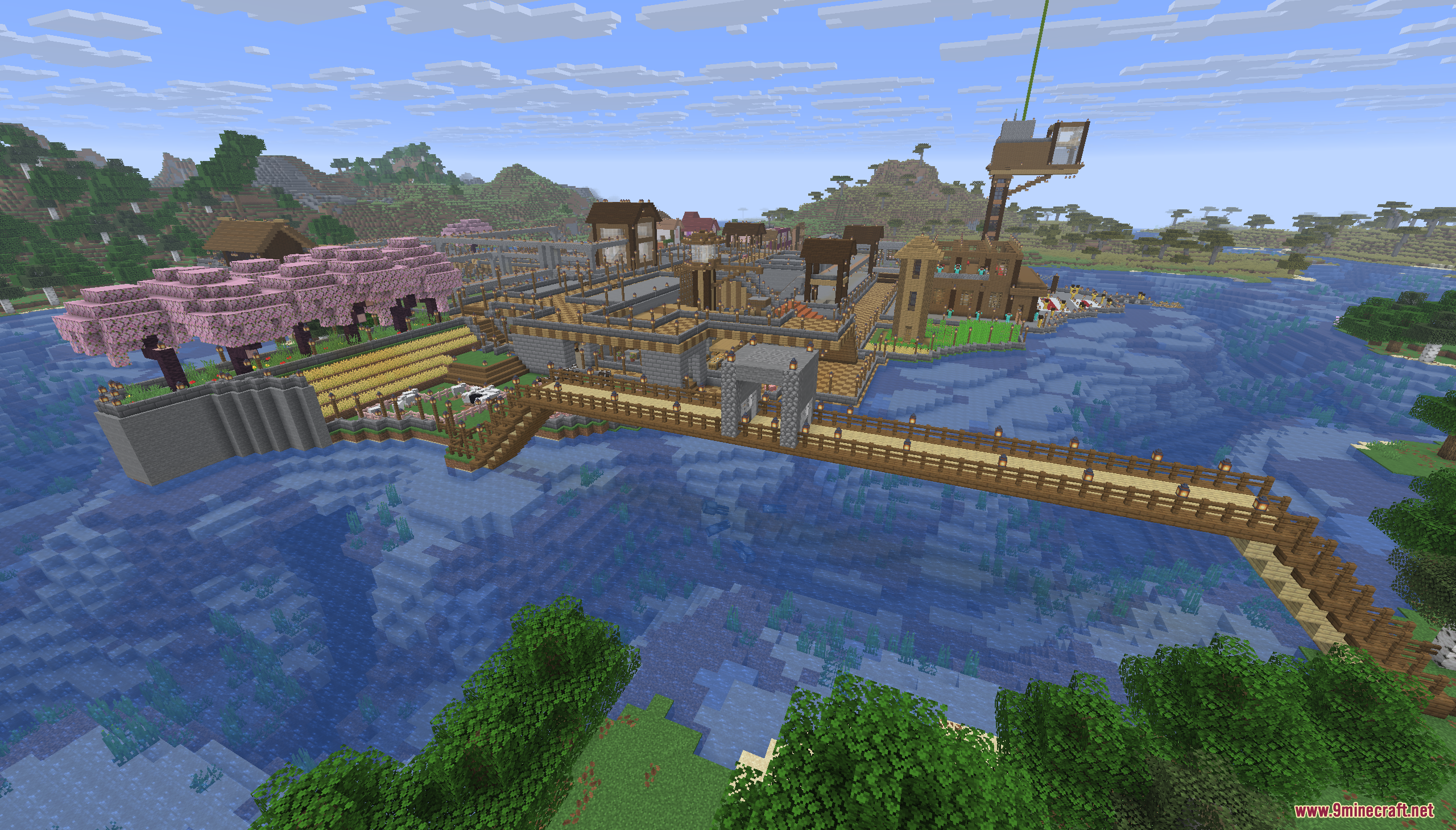 A sprawling island base with a long wooden bridge crossing the blue water