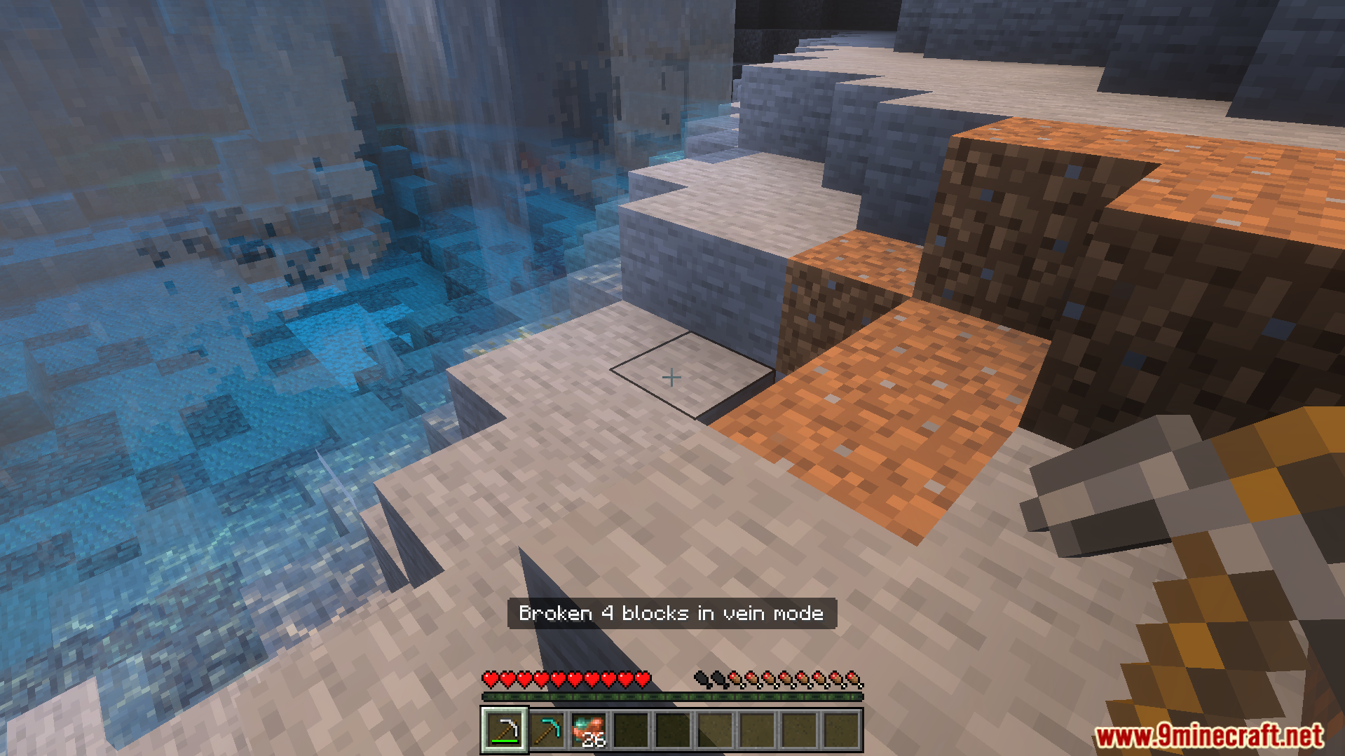 Breaking four blocks at once in a cave using the vein mining feature